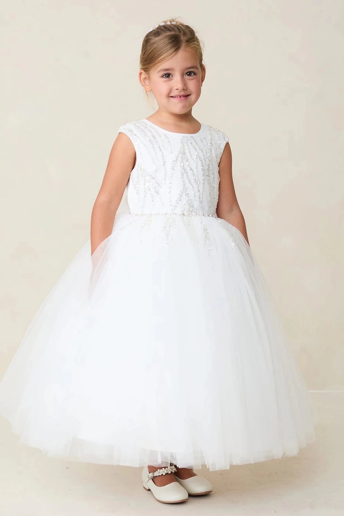Textured bodice on a white flower girl dress.