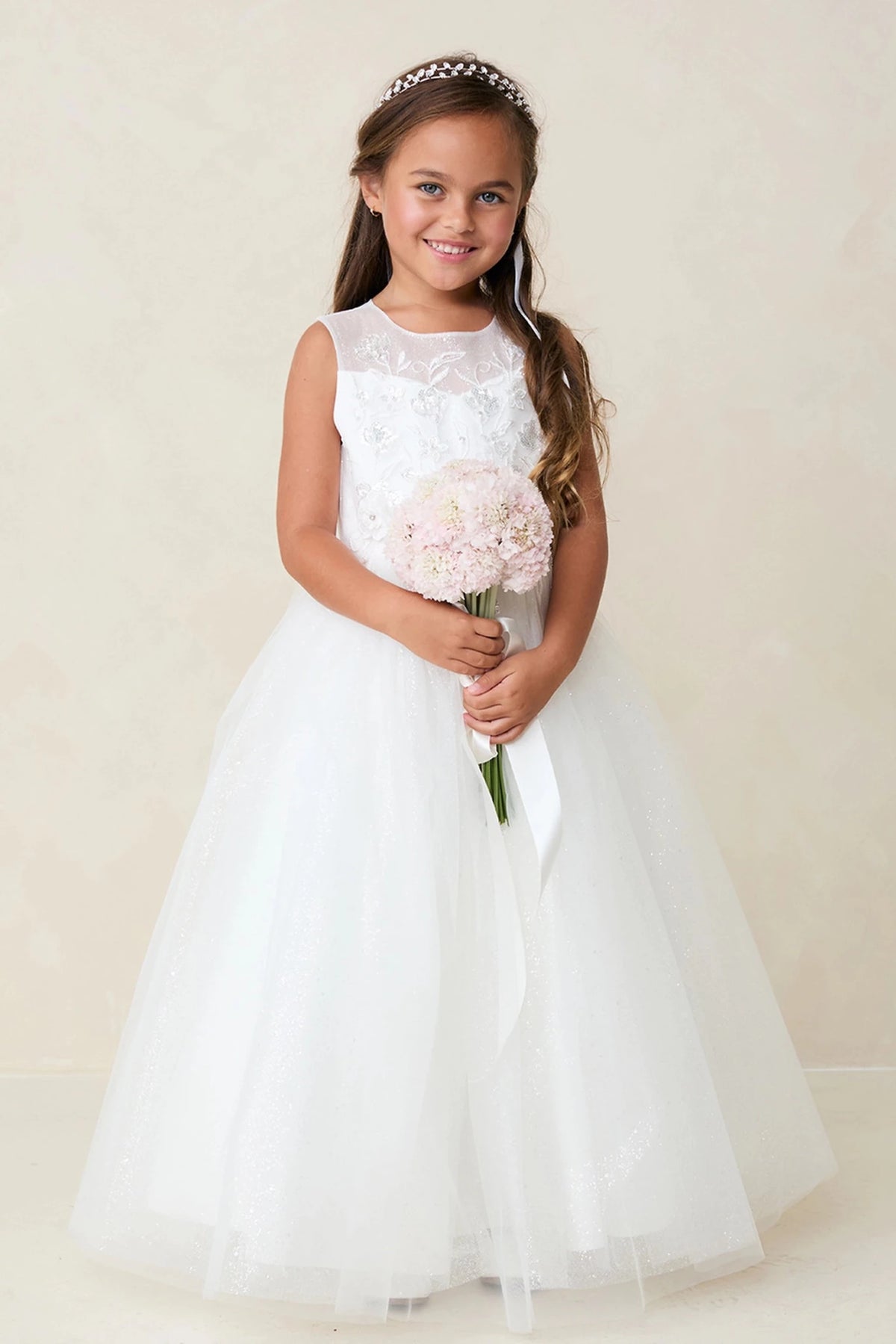 Off-White flower girl dress featuring a full tulle skirt.