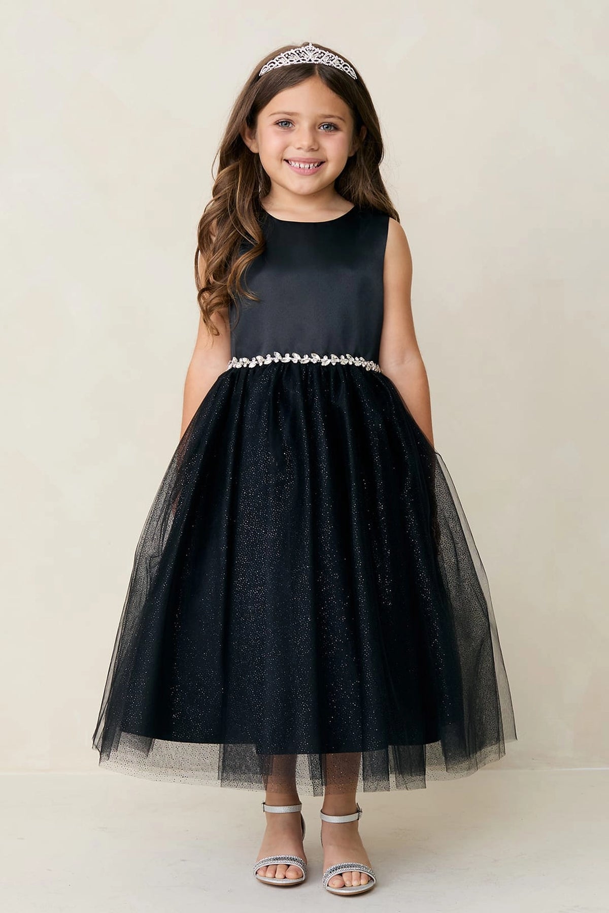 Black kids pageant dress featuring a satin bodice and sparkling tulle skirt.