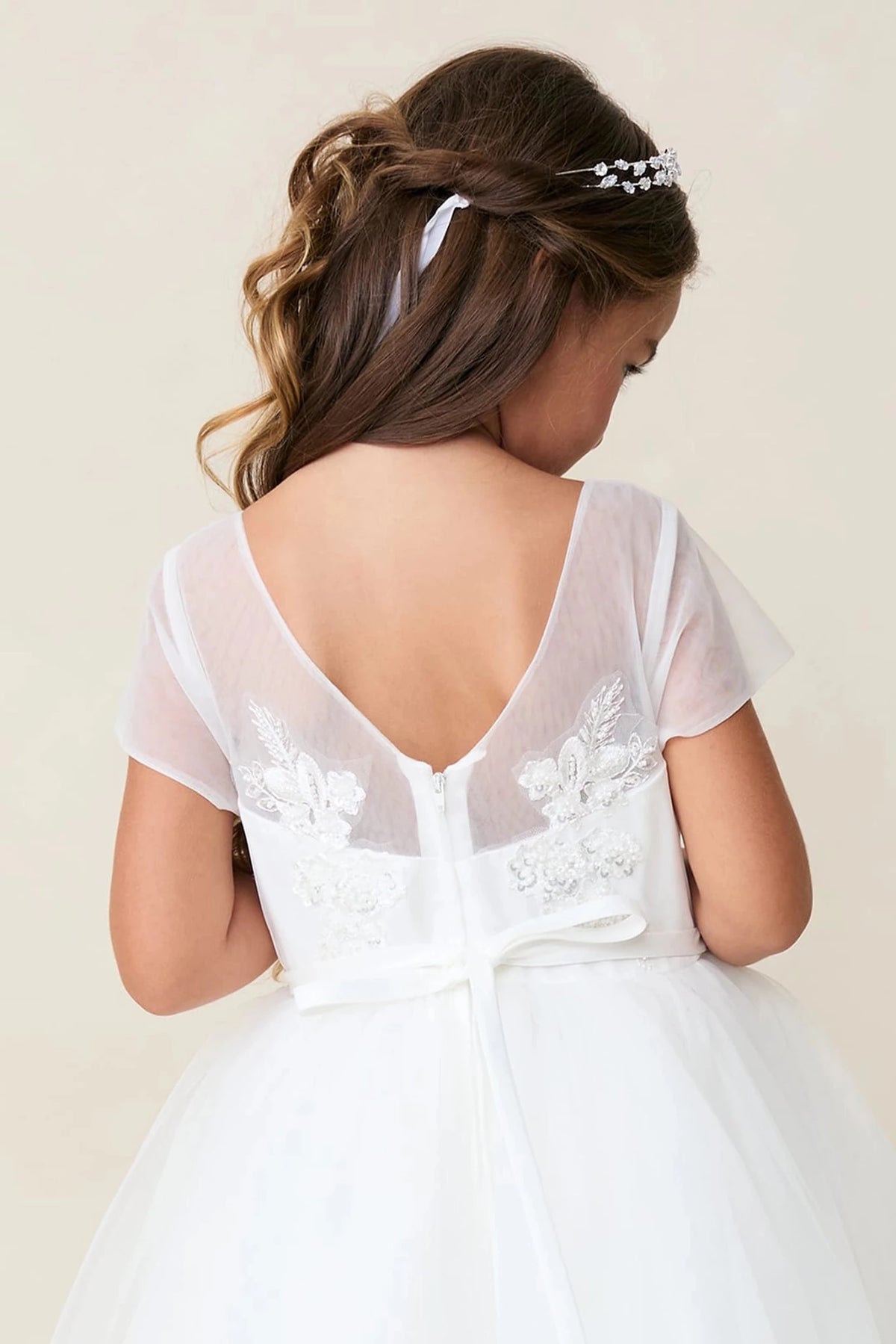 Featuring deep V-shaped back, an off-white flower girl dress.
