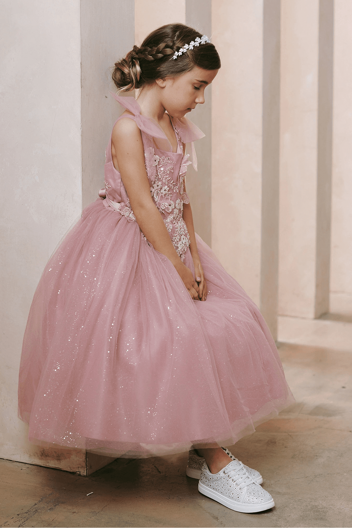 Dusty Rose flower girl dress featuring a gathered glitter skirt.
