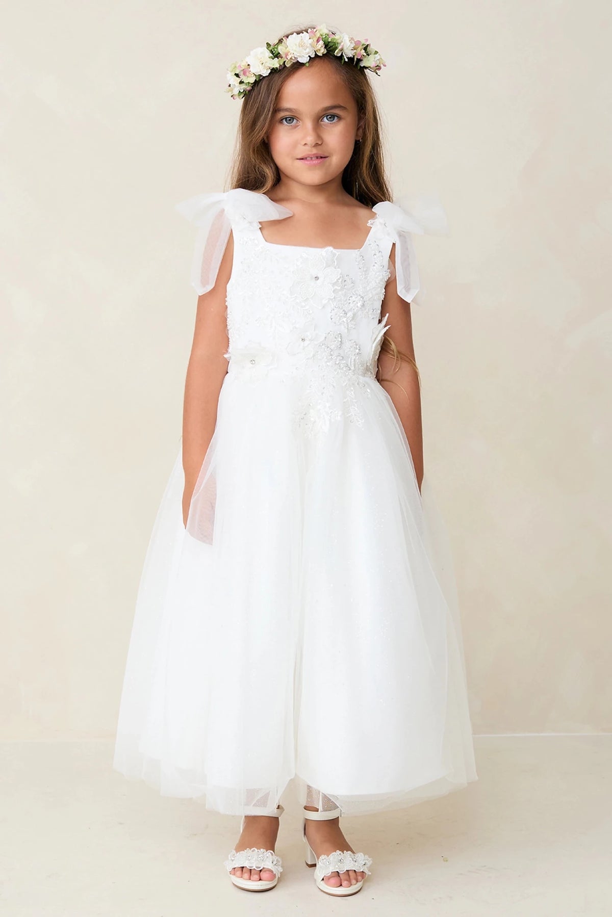 Full gathered skirt accents this off-white flower girl dress.