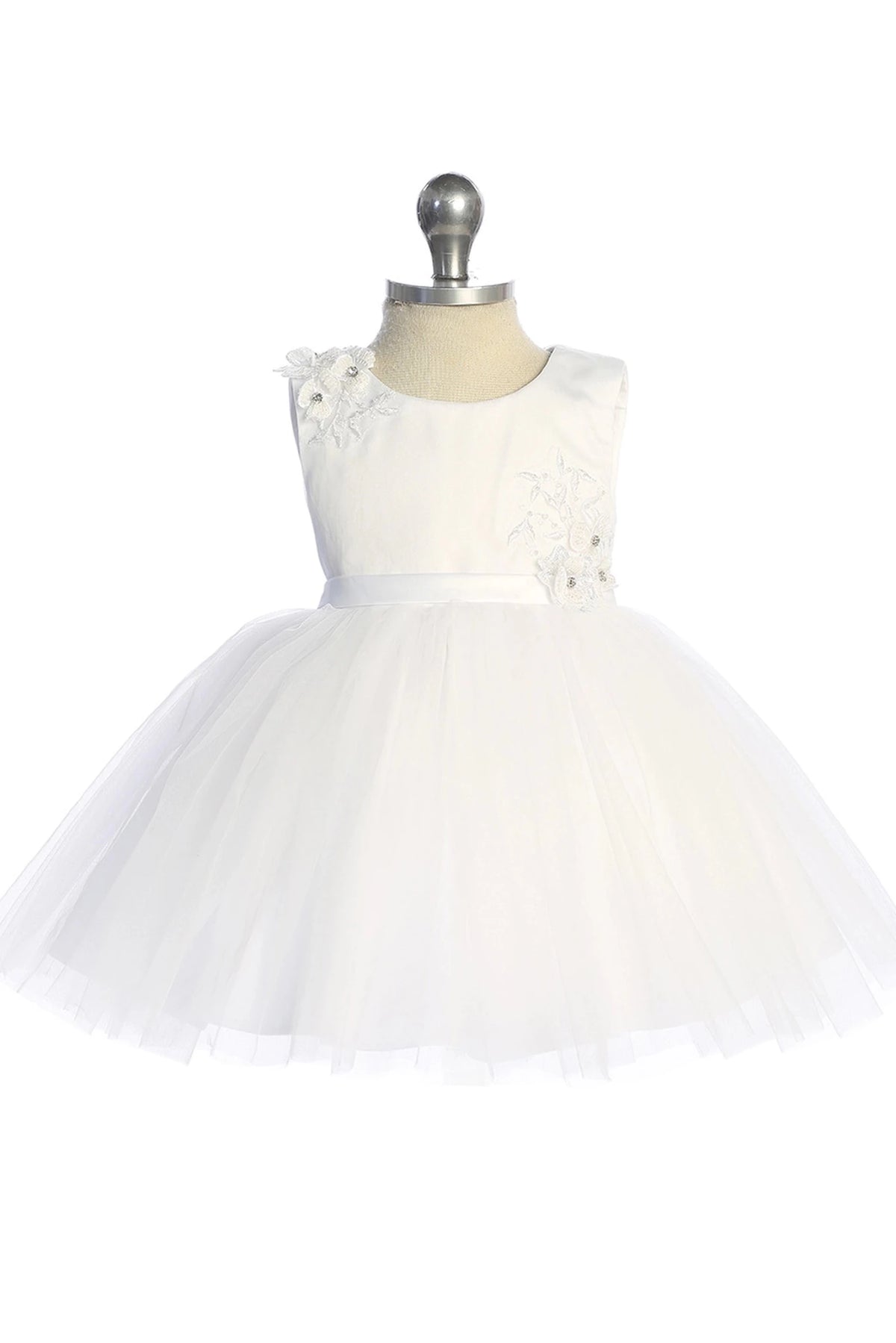 Flower bodice appliques accent the white flower girl dress.