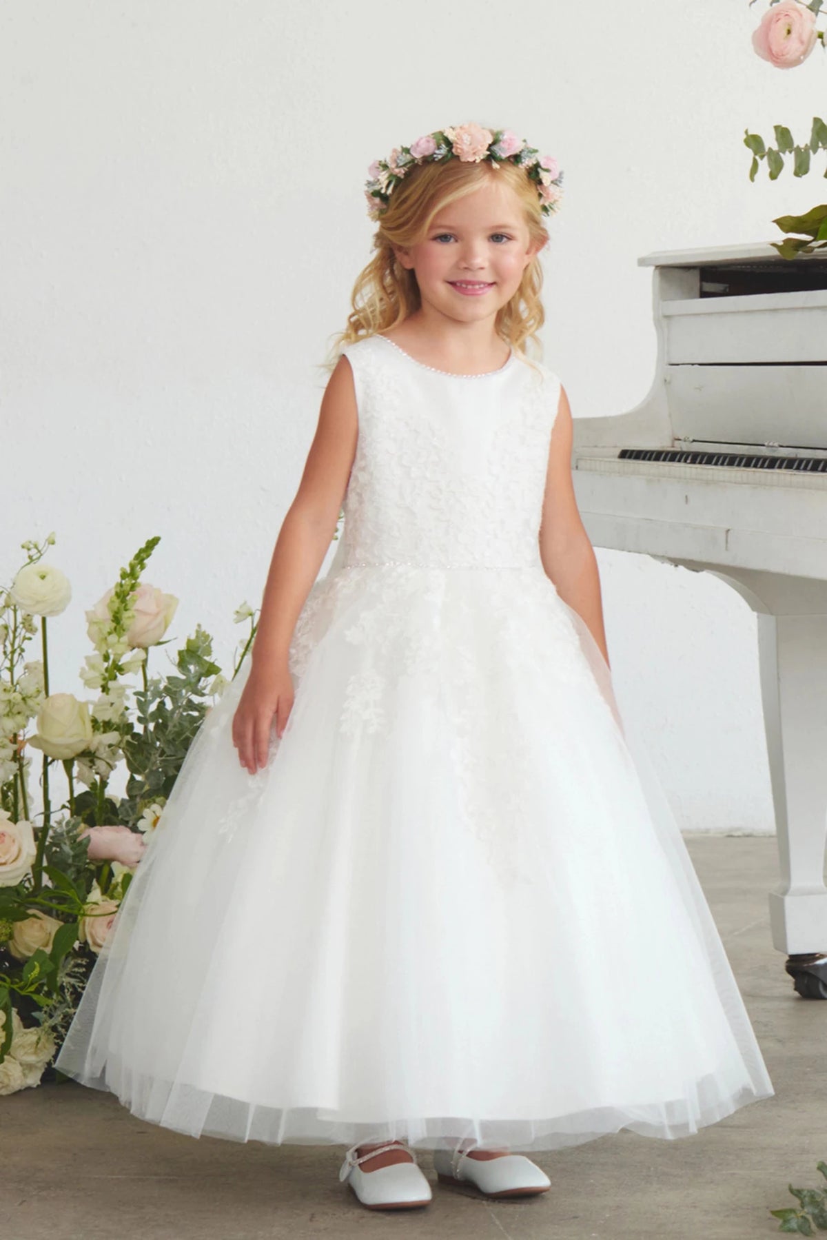 Floral lace bodice is visible on the off-white flower girl dress.