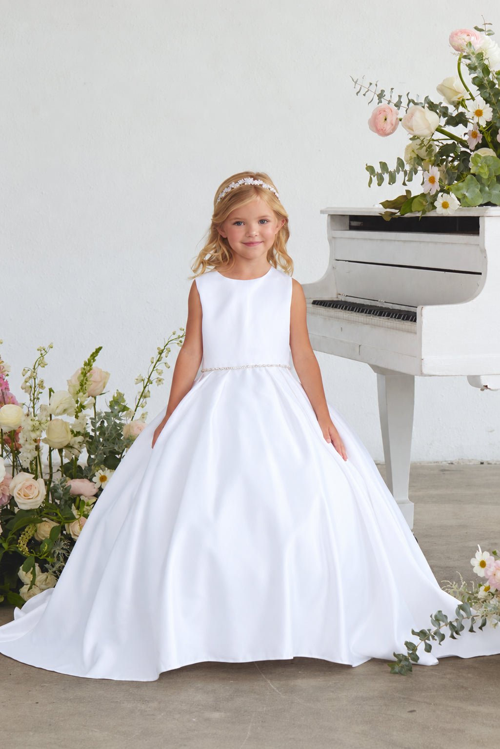 Front view of Tiptop 5925 white satin flower girl dress with a sleeveless bodice, beaded waistband and full skirt.