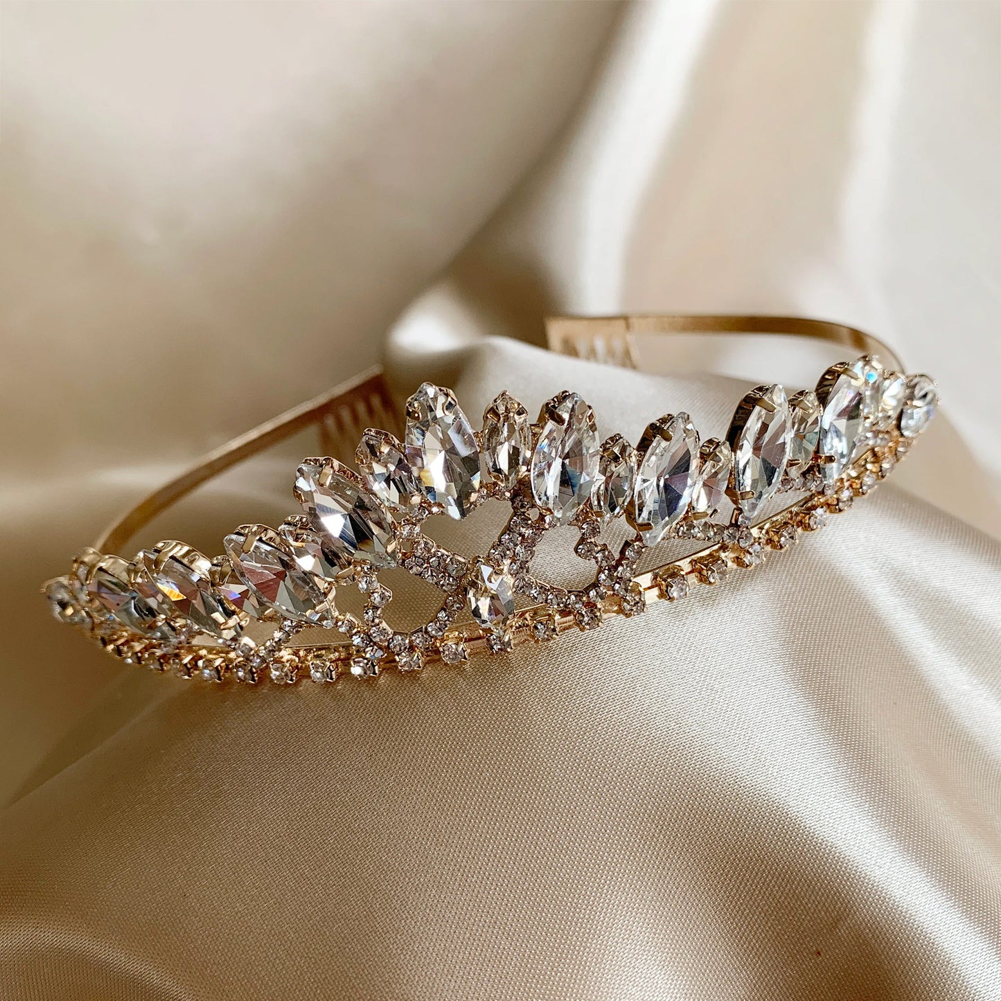 Gold rhinestone flower girl tiara, close-up, front view, embellishment detail.