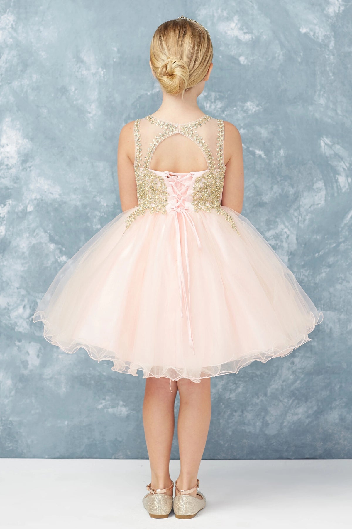 Visible details on the Blush kids pageant dress include a tied sash across the back waist.