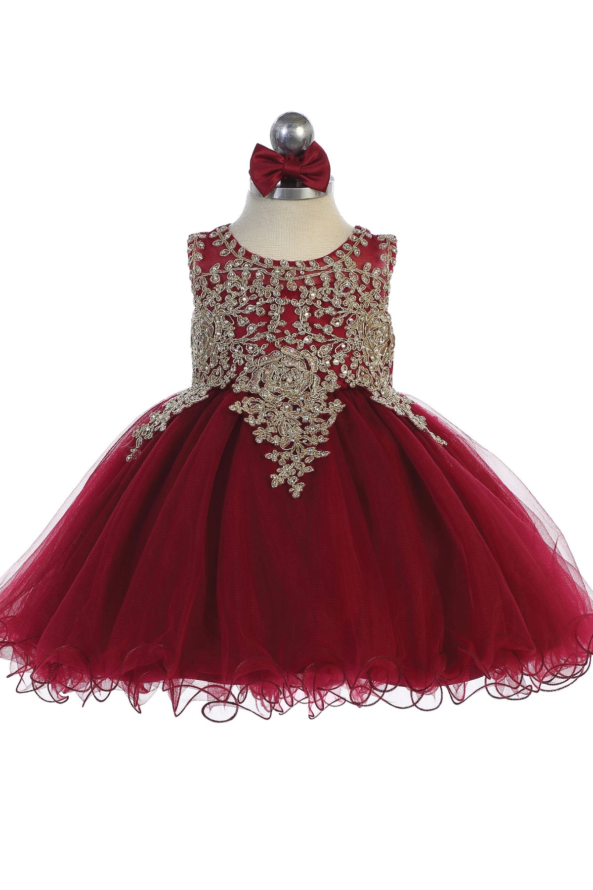 The Burgundy kids pageant dress has metallic floral lace.