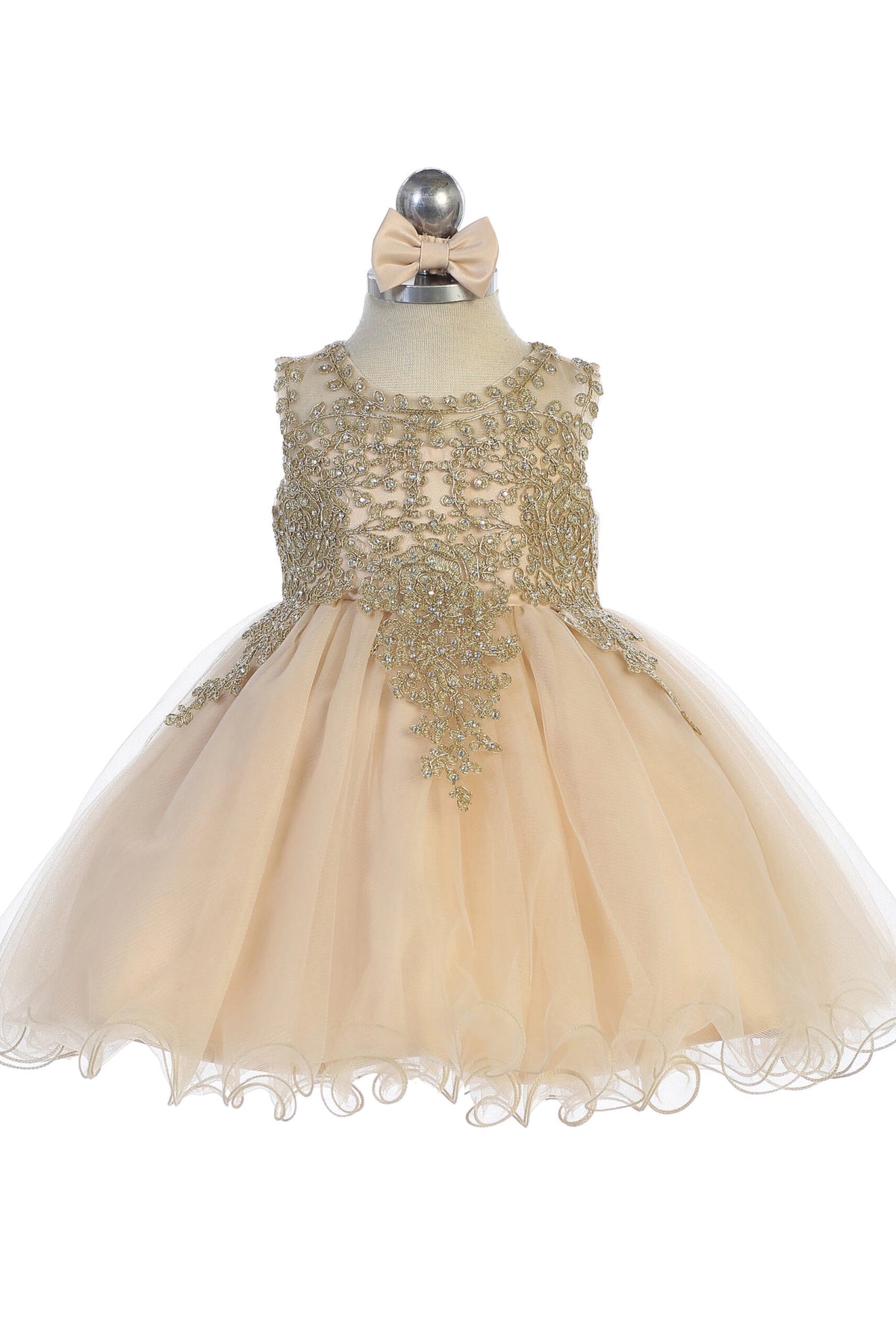 The Champagne kids pageant dress has metallic floral lace.