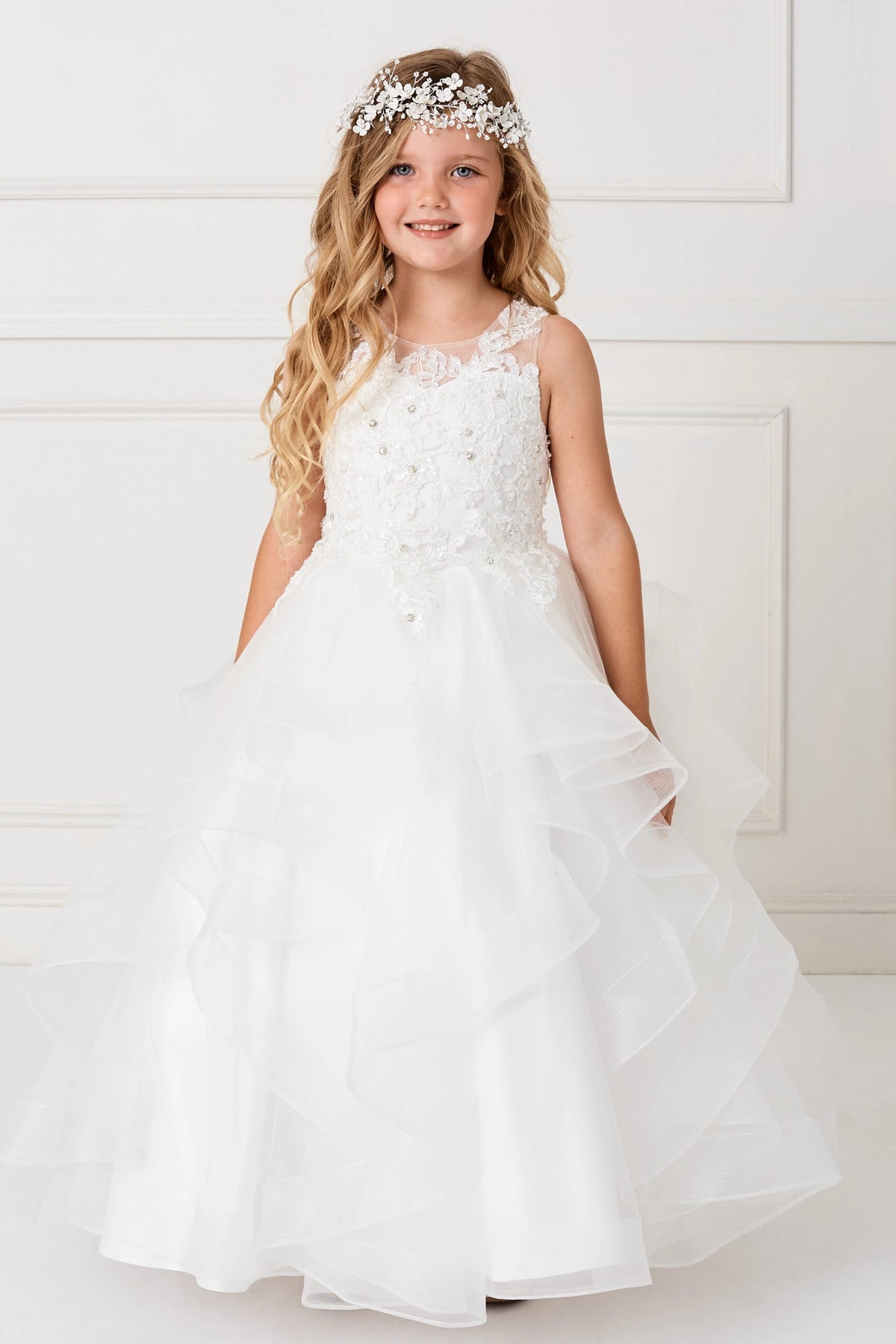White kids pageant dress featuring a lace bodice and tiered mesh skirt.