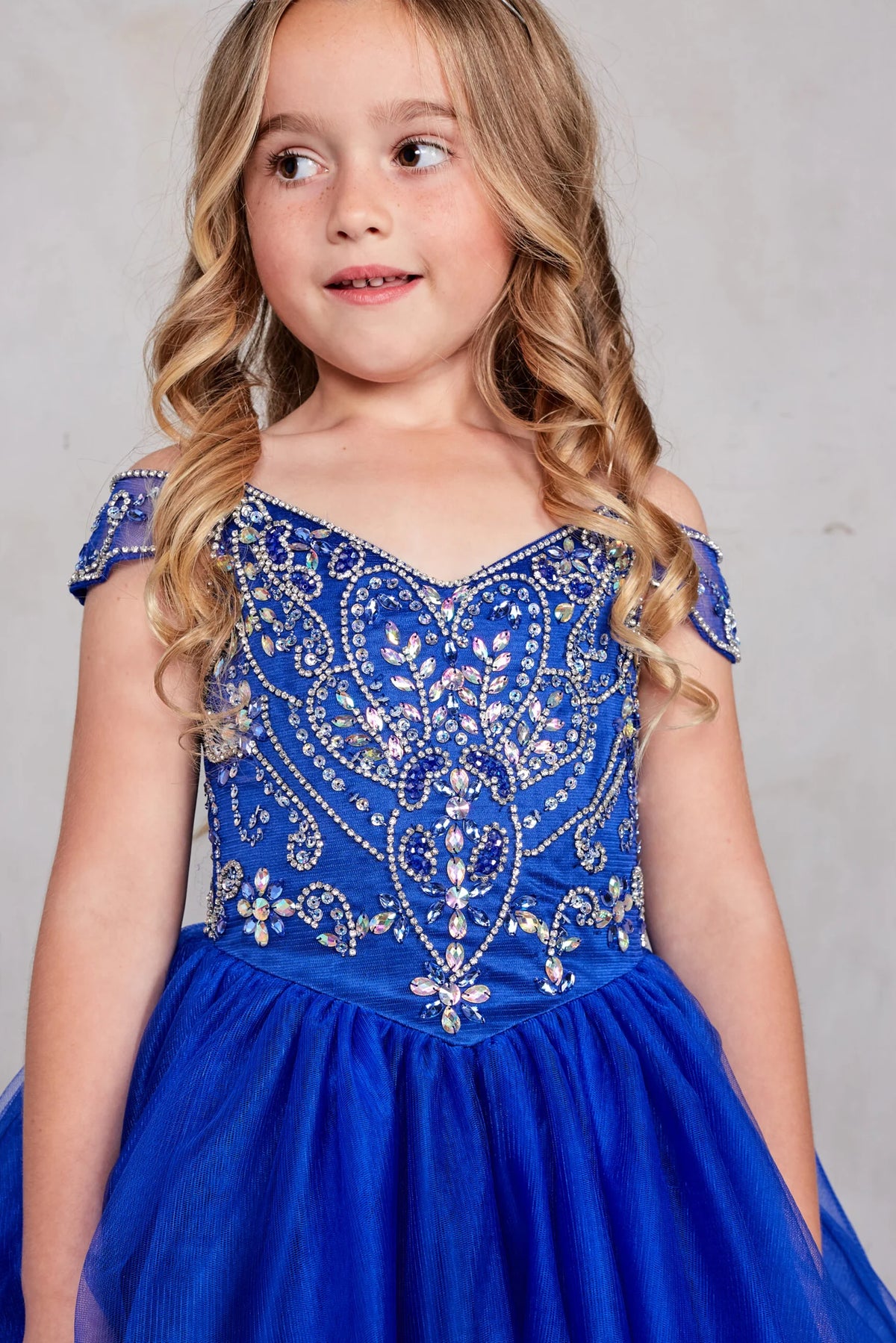 Visible details on the Royal Blue kids pageant dress include the beaded V-neckline.