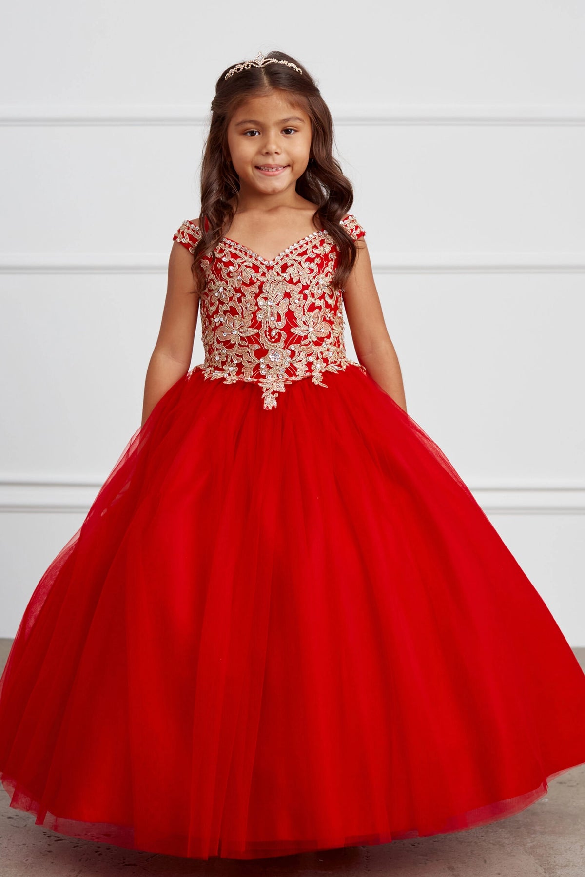 Red kids pageant dress featuring gold floral lace on the bodice.