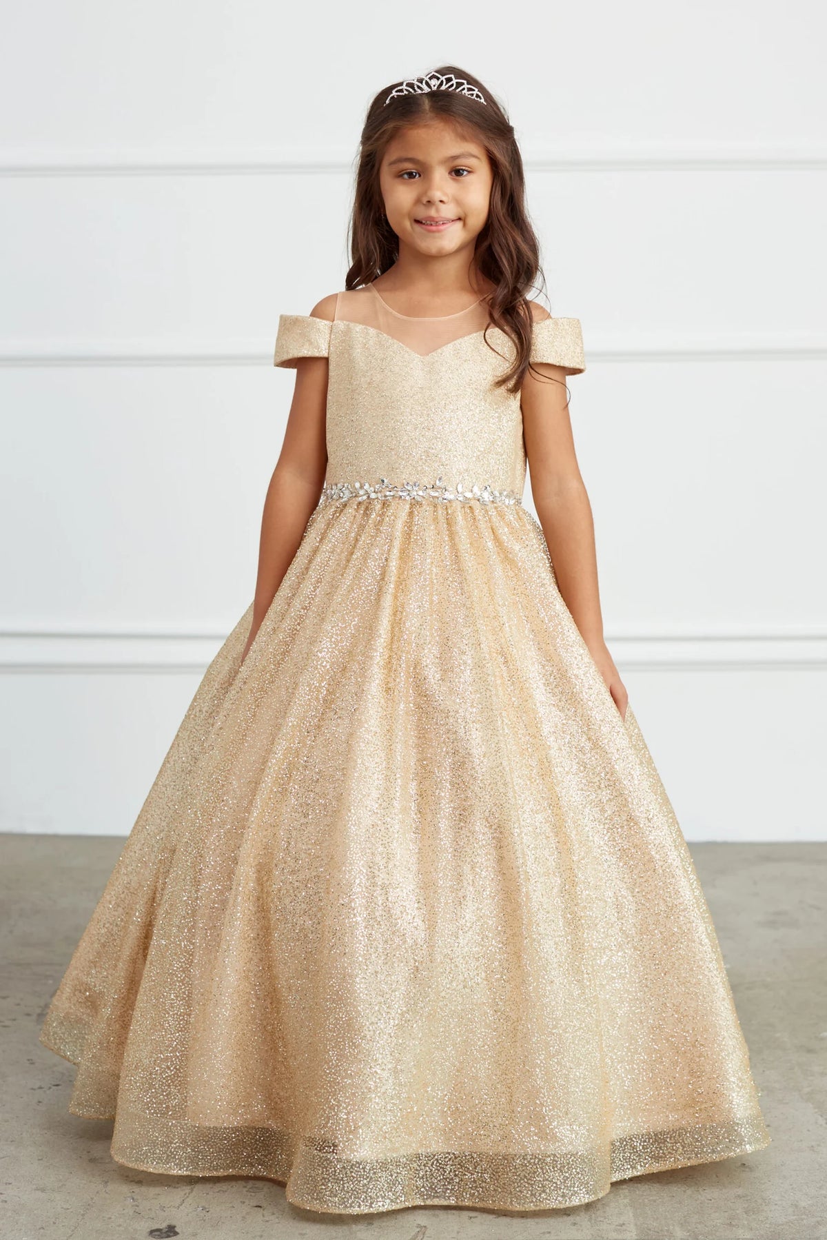 Gold kids pageant dress featuring a rhinestone waist and glitter skirt.