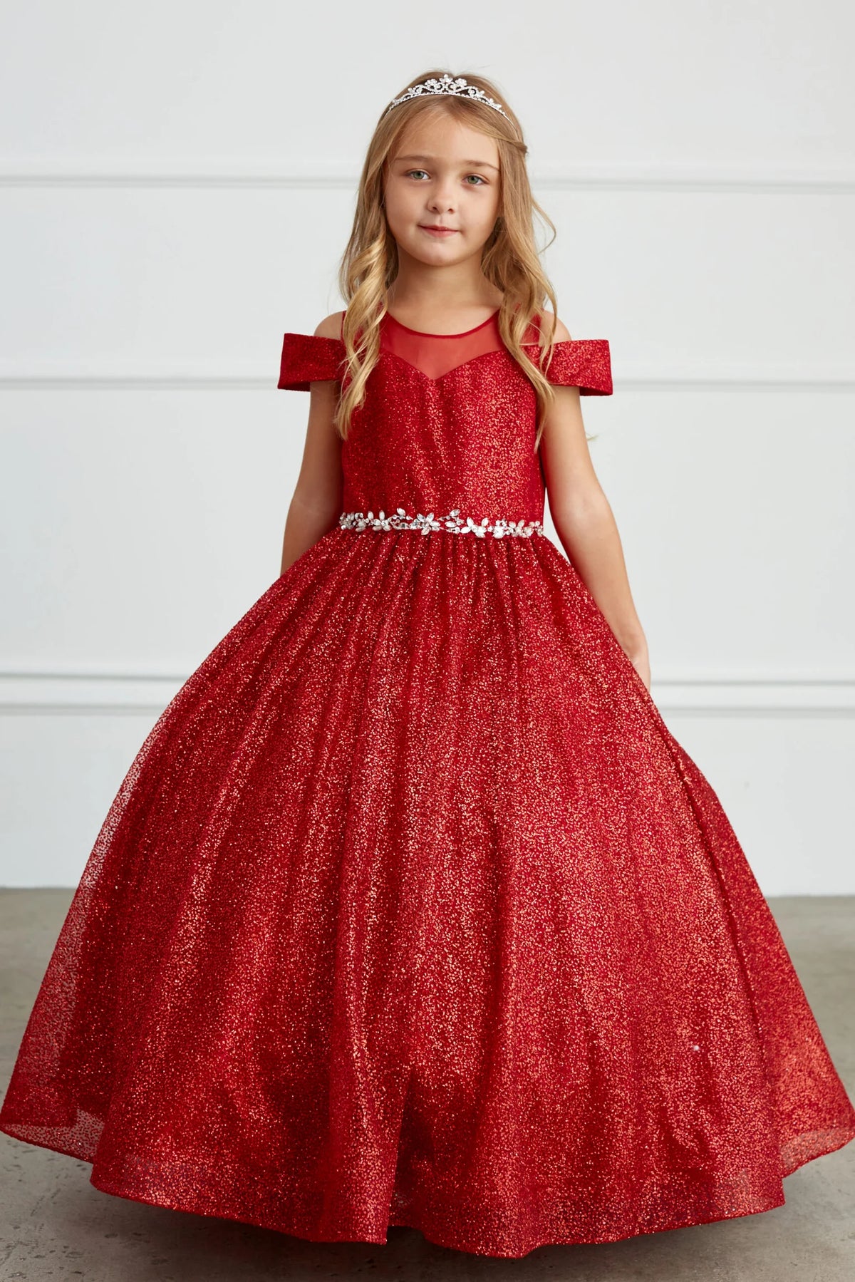 Red kids pageant dress featuring a rhinestone waist and glitter skirt.