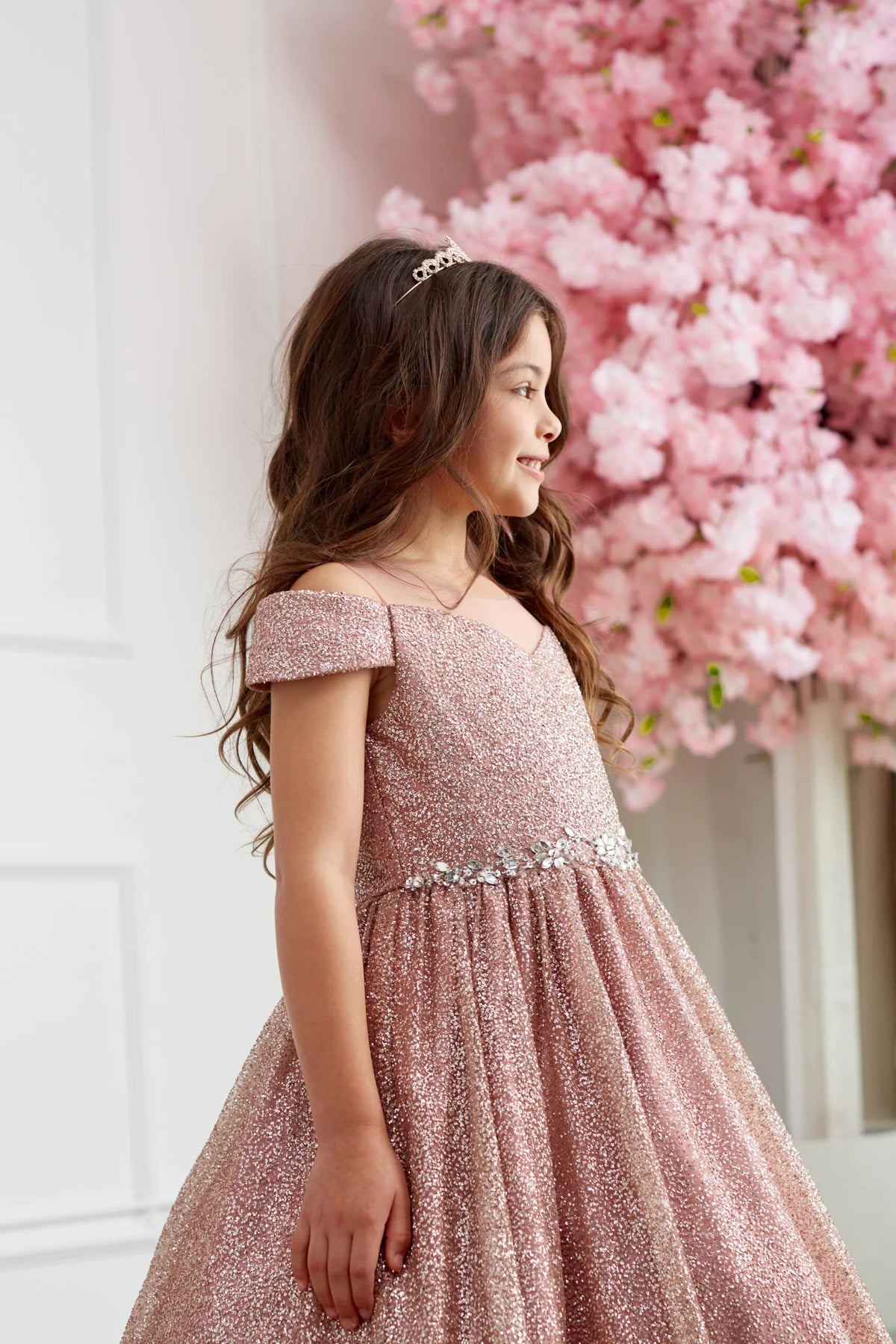 Rose Gold kids pageant dress featuring a rhinestone-trimmed neckline.