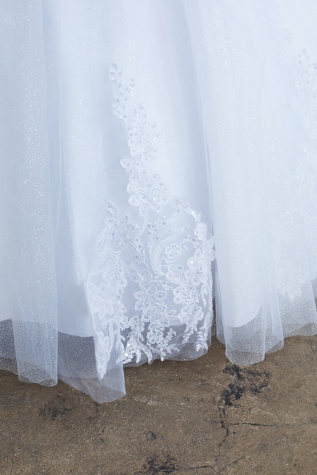 On the White kids pageant dress, the detailing includes corded floral lace.