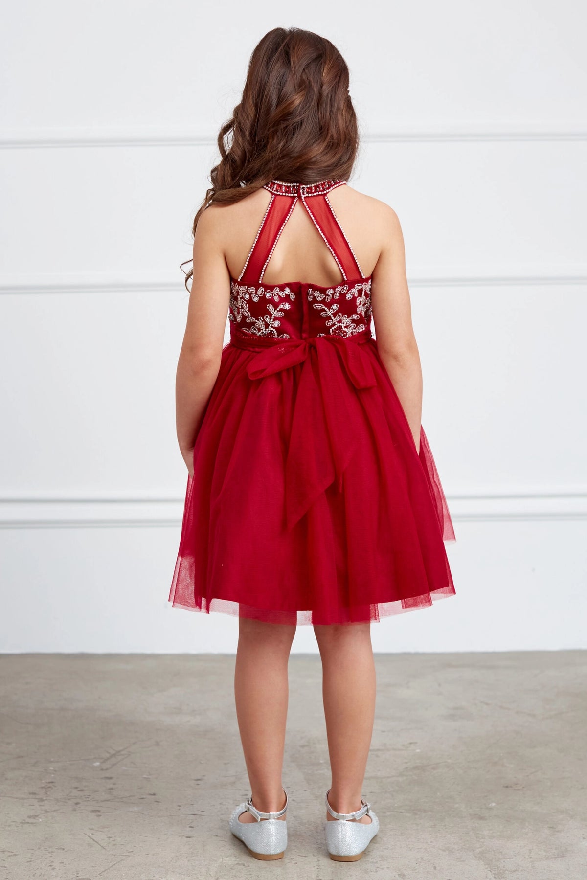 Visible details on the Red kids pageant dress include a tied sash across the back waist.