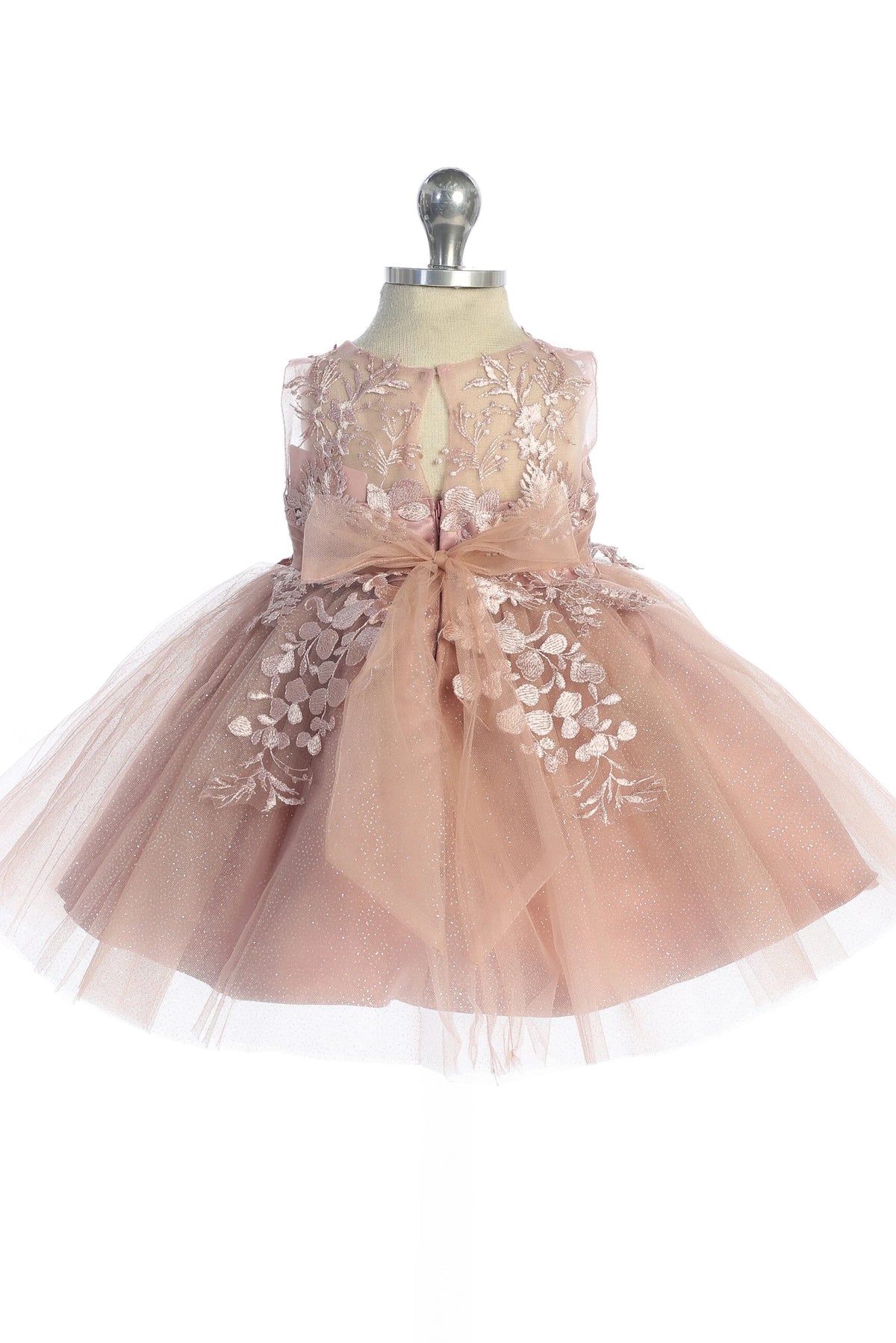Seen from behind, this Dusty Rose kids pageant dress displays a tied sash across the back waist.