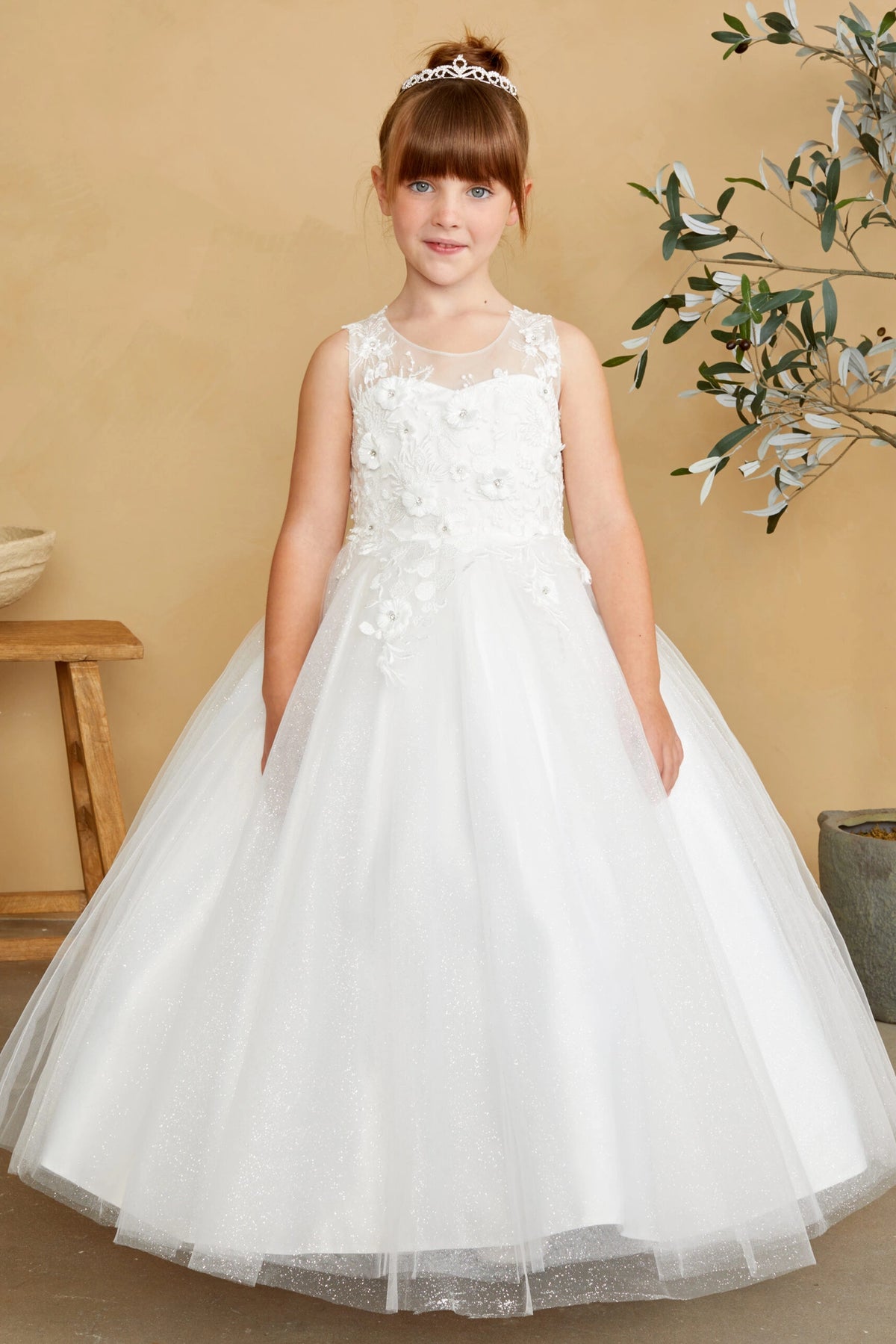 The Ivory kids pageant dress has dimensional floral lace.