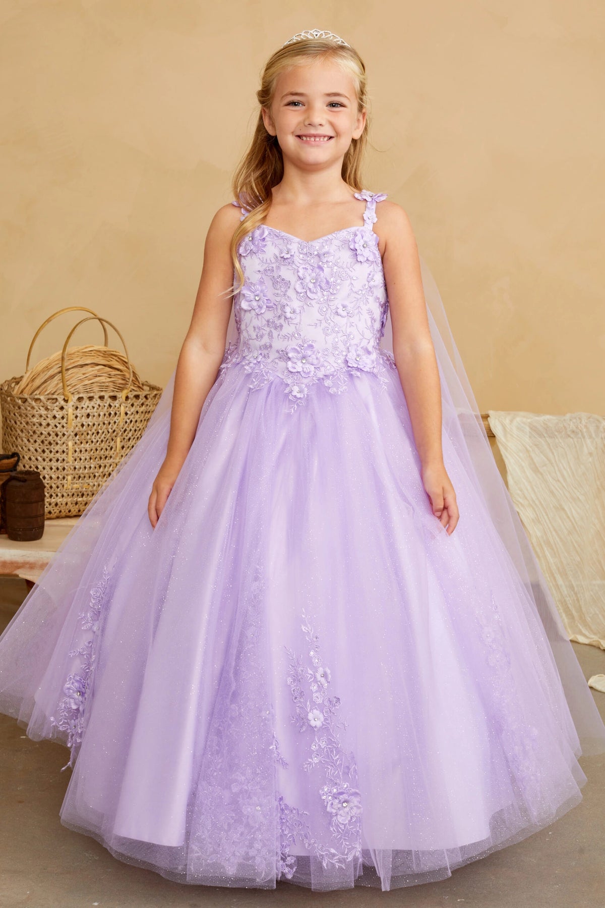 Lilac kids pageant dress featuring floral appliques on a full tulle skirt.
