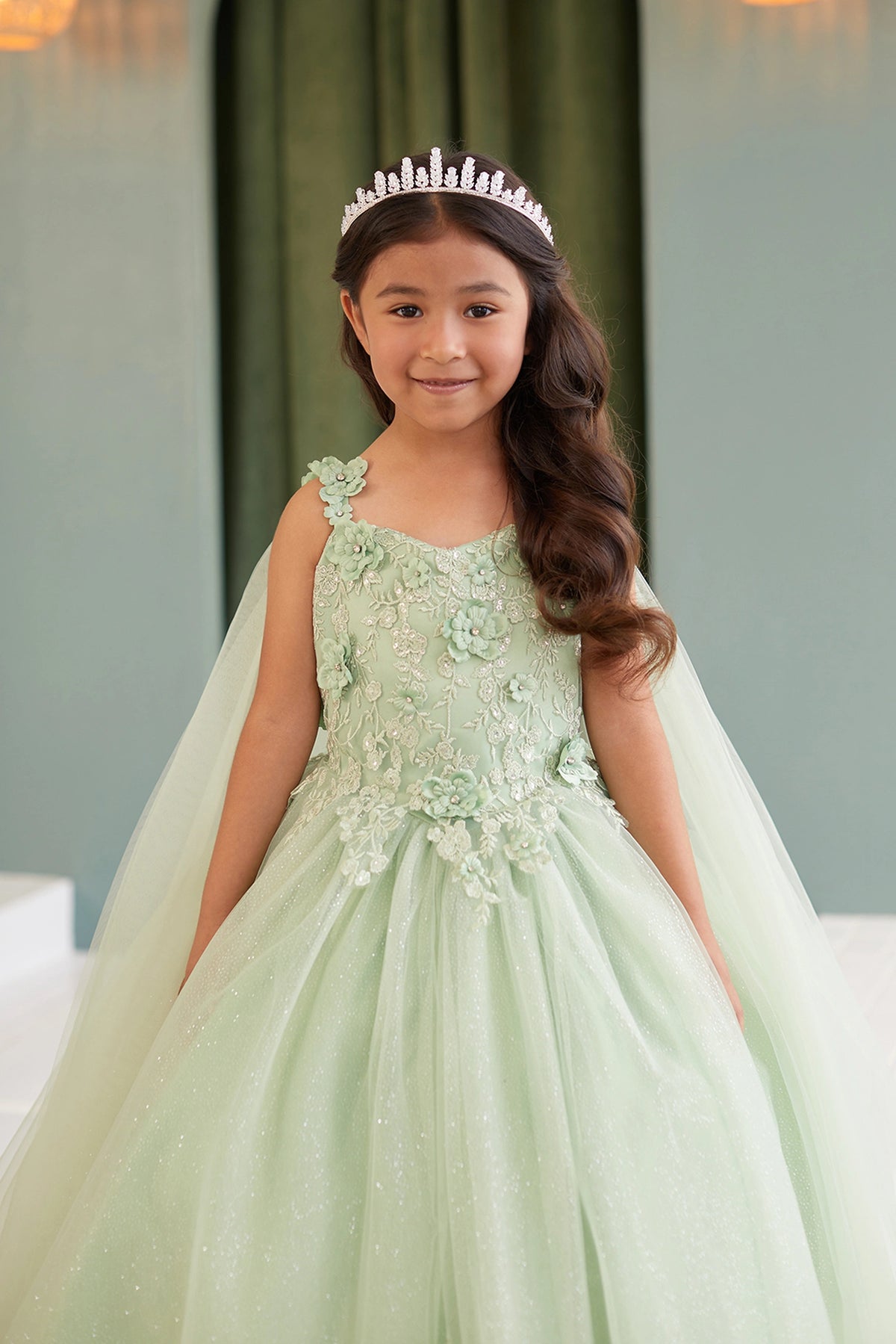 Sage kids pageant dress featuring floral appliques on a full tulle skirt.