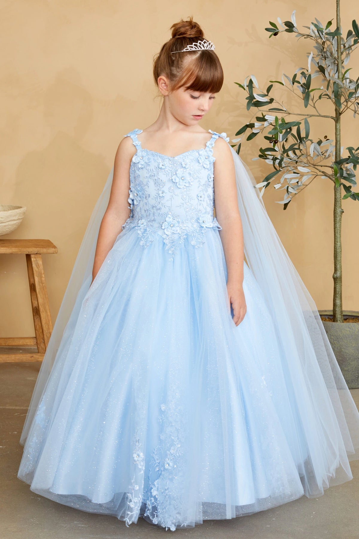 Sky Blue kids pageant dress featuring floral appliques on a full tulle skirt.