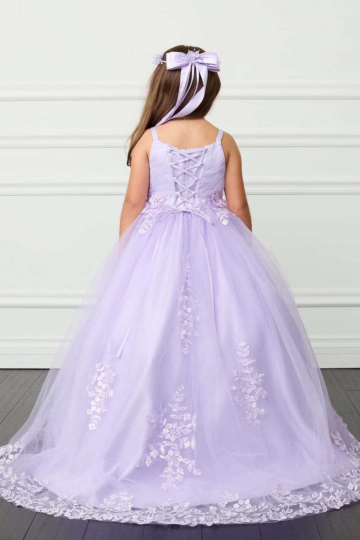 The Lilac kids pageant dress has lace-up ties at the back.