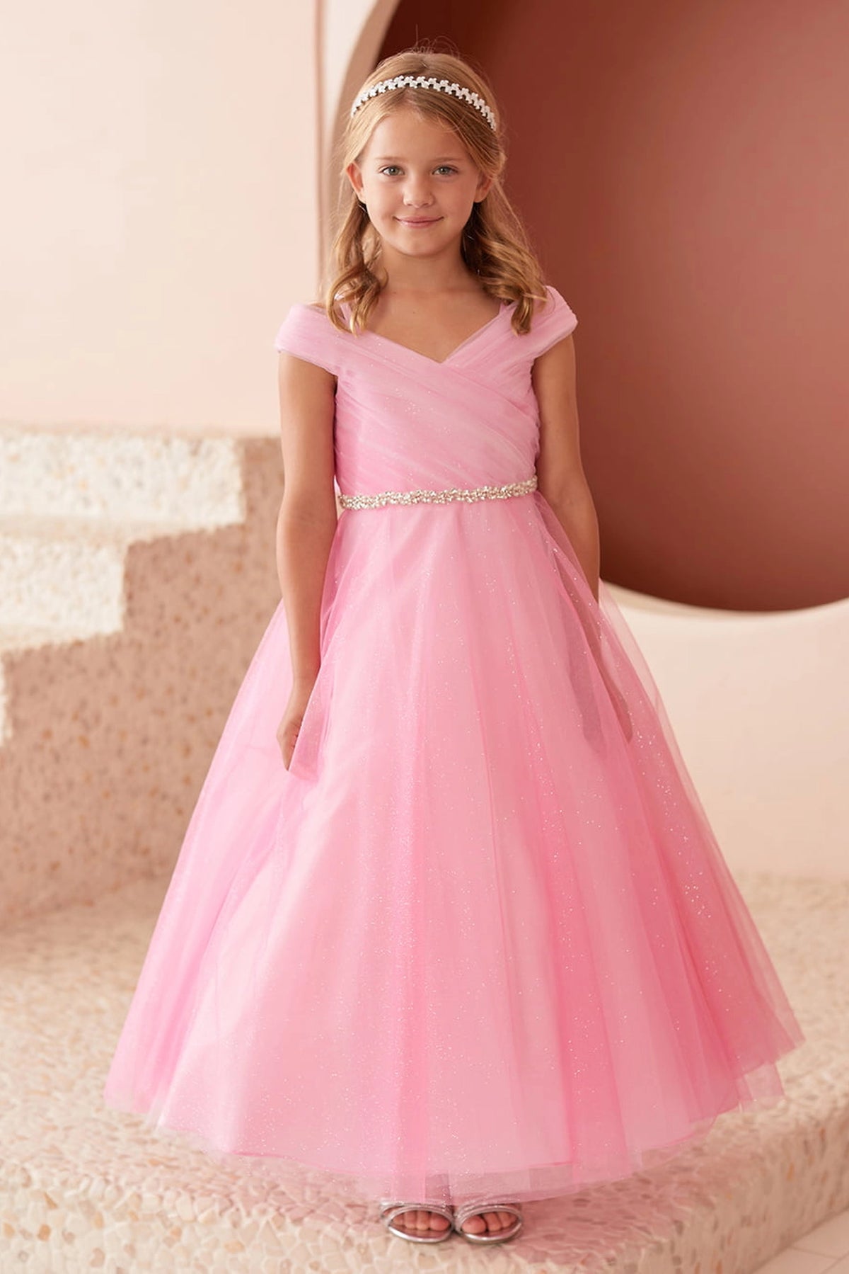 Hot Pink kids pageant dress featuring an asymmetrically pleated neckline.
