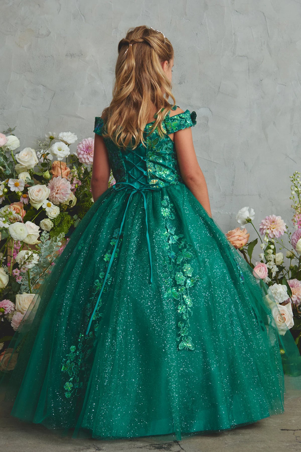 The Emerald kids pageant dress has lace-up ties at the back.