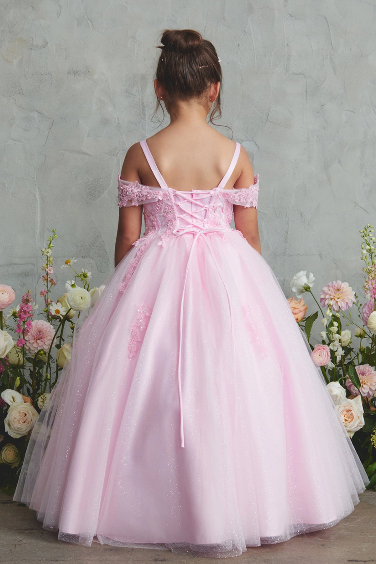 The Pink kids pageant dress has lace-up ties at the back.