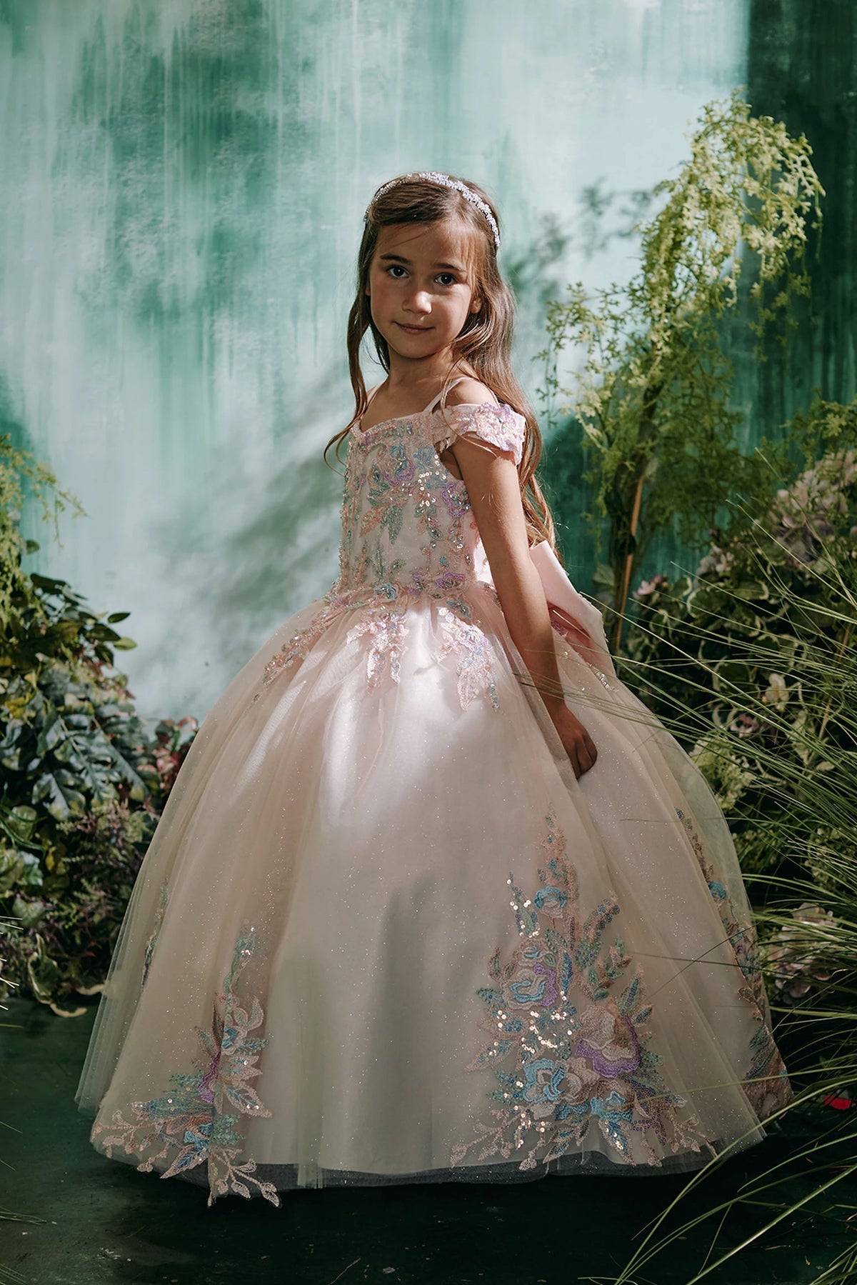 The Blush kids pageant dress has multicolor floral lace.