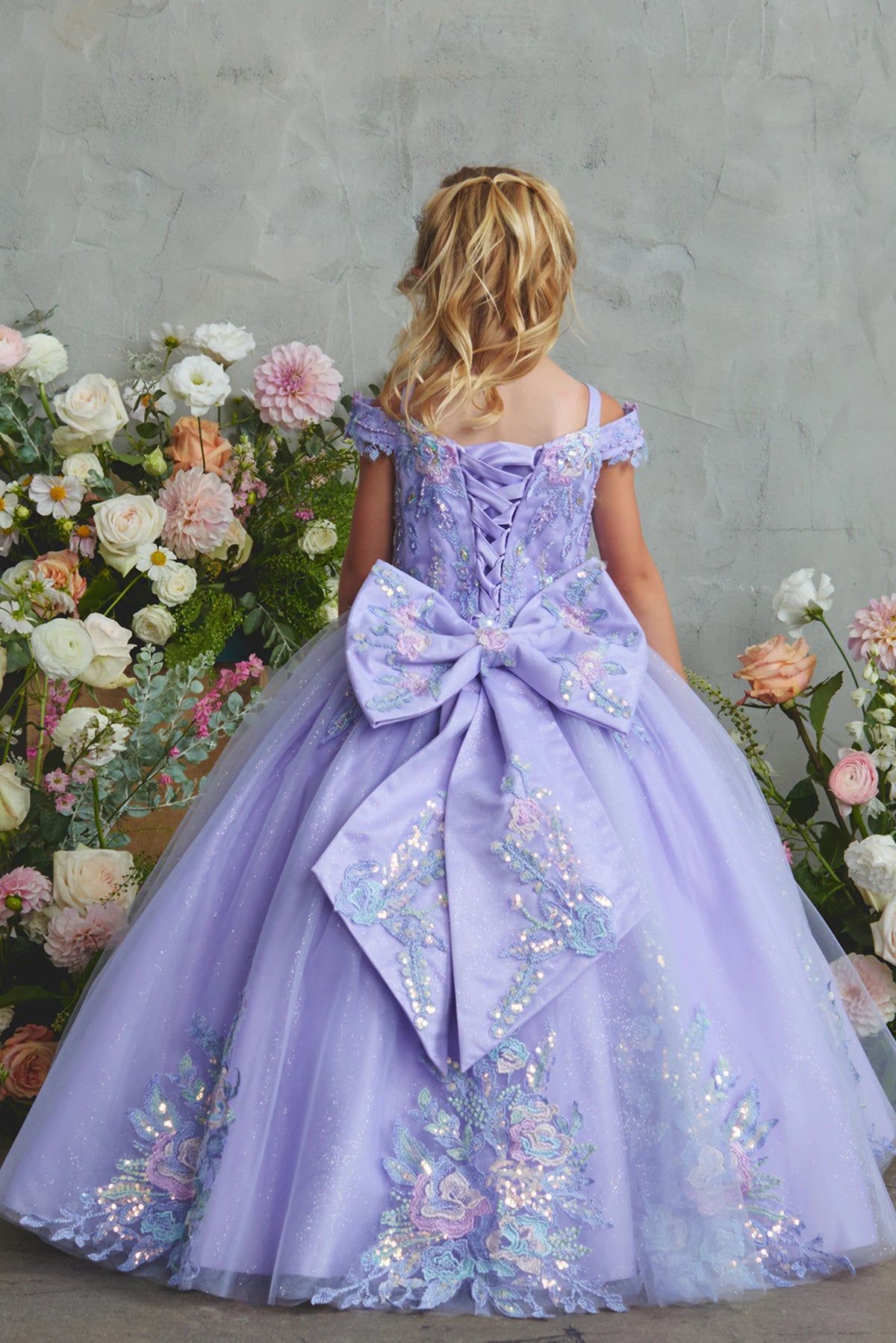 Another view of the Lilac kids pageant dress shows lace-up ties at the back.