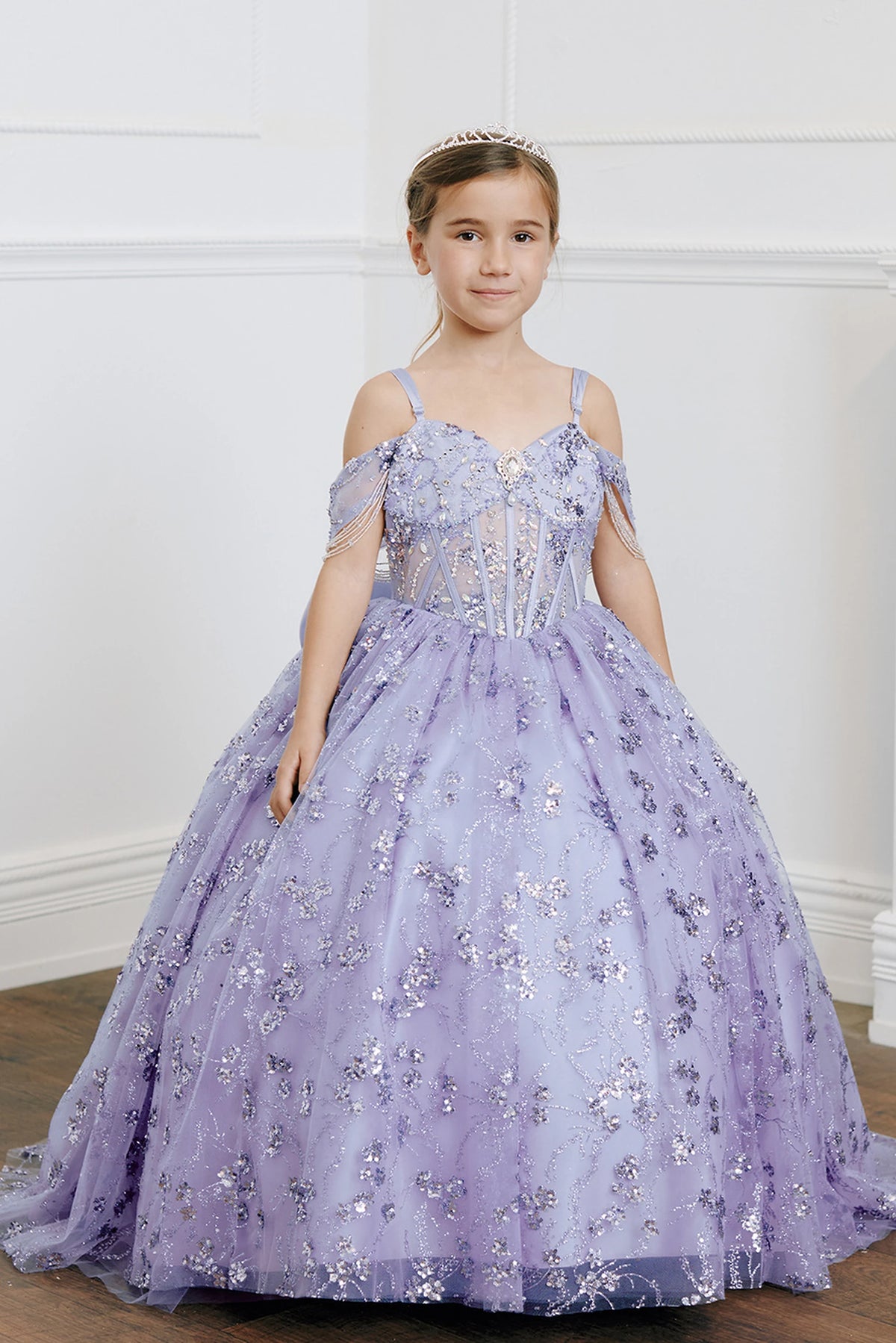 Lilac kids pageant dress featuring beadwork over sheer bodice panels.