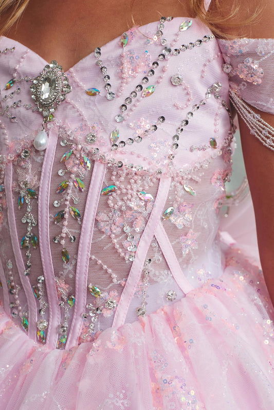 Pink mini quince dress featuring crystal bodice centerpiece.
