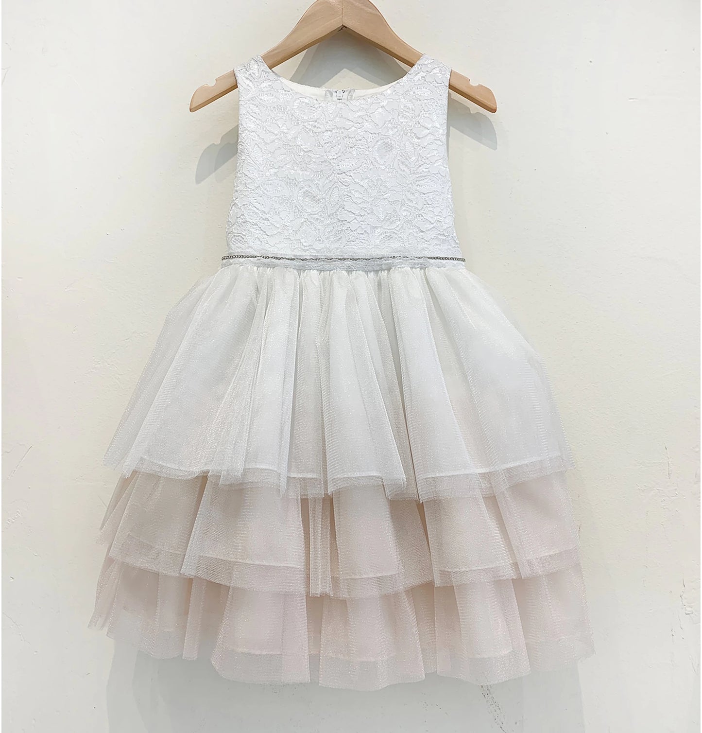 White lace flower girl dress with a layered tulle skirt.