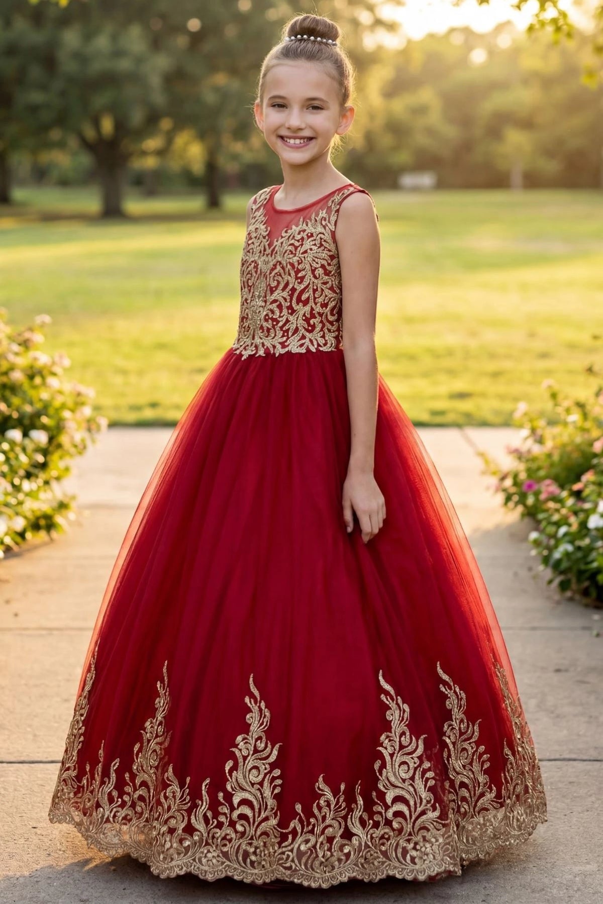 Details of the Red kids dress show gold embroidery across the sleeveless bodice.