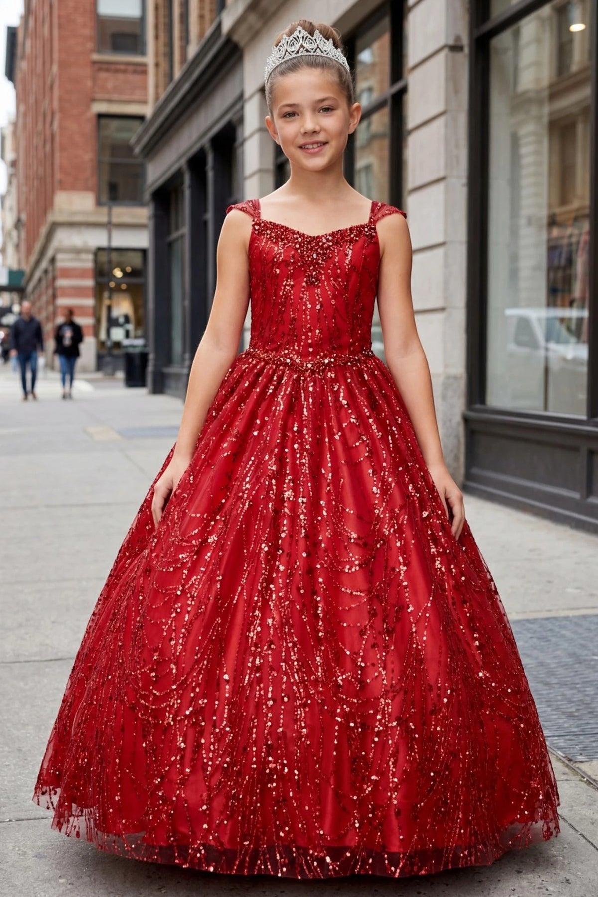 Red mini quince dress with a sparkling fitted bodice and full glitter skirt.