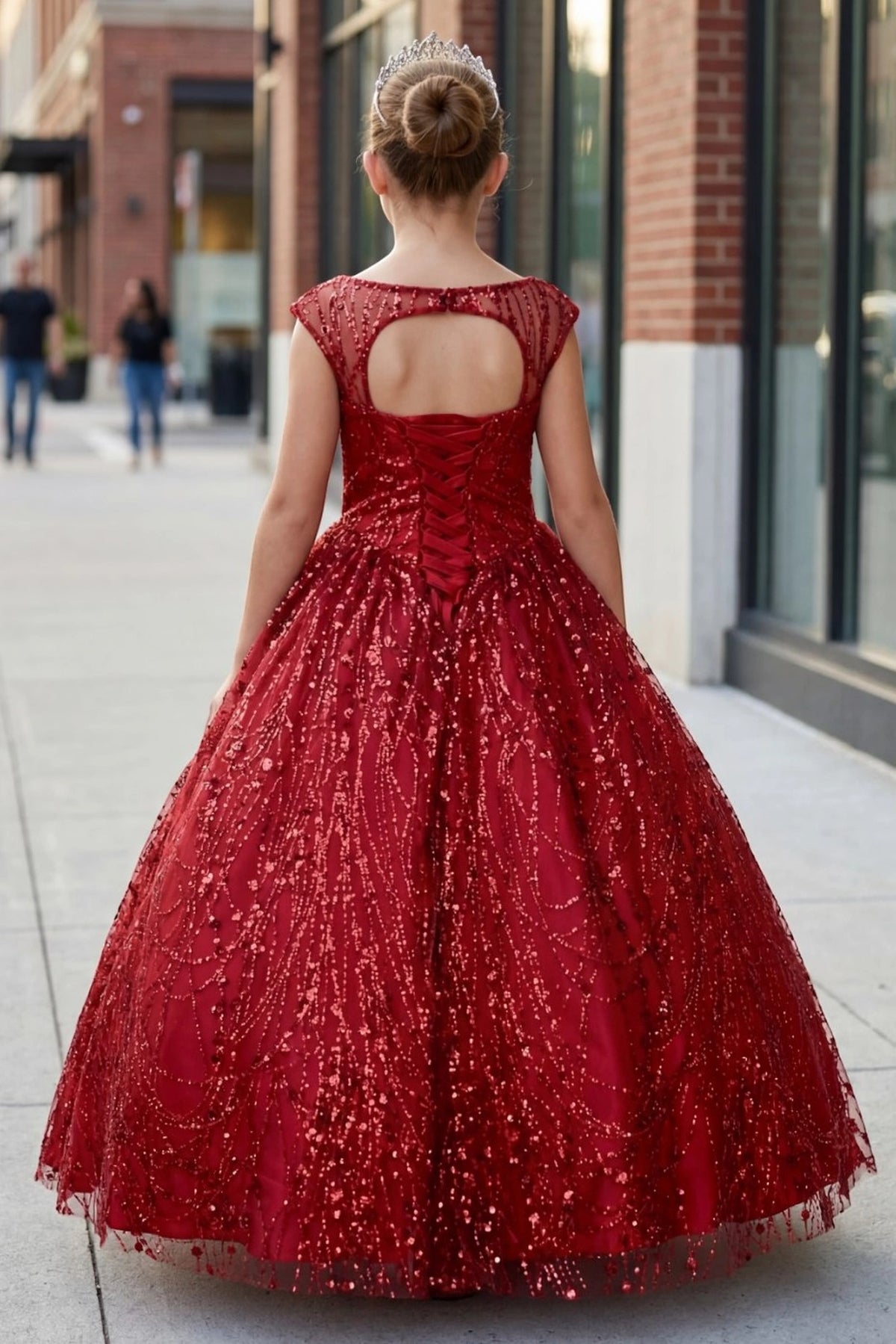 Details of this Red mini quince dress include a keyhole upper back and full glitter skirt.