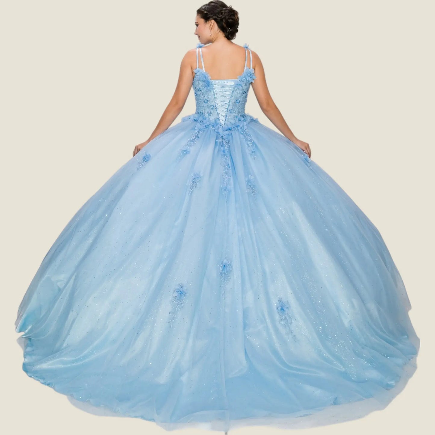 Back view of a blue quinceanera dress with lace-up corset, 3D floral appliques, glitter tulle layers, and chapel-length train