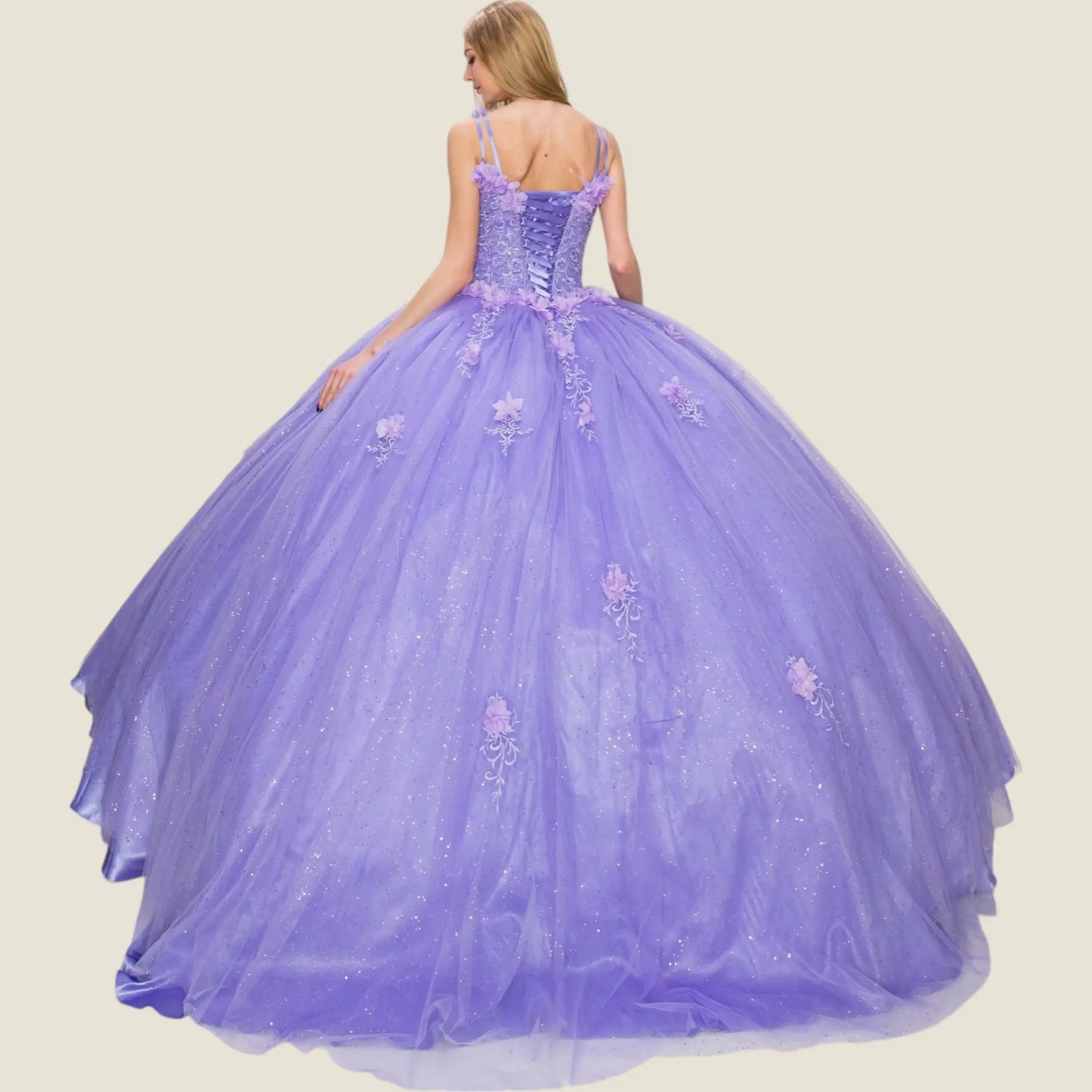 Back view of a lilac quinceanera dress with lace-up corset, 3D floral appliques, glitter tulle layers, and chapel-length train