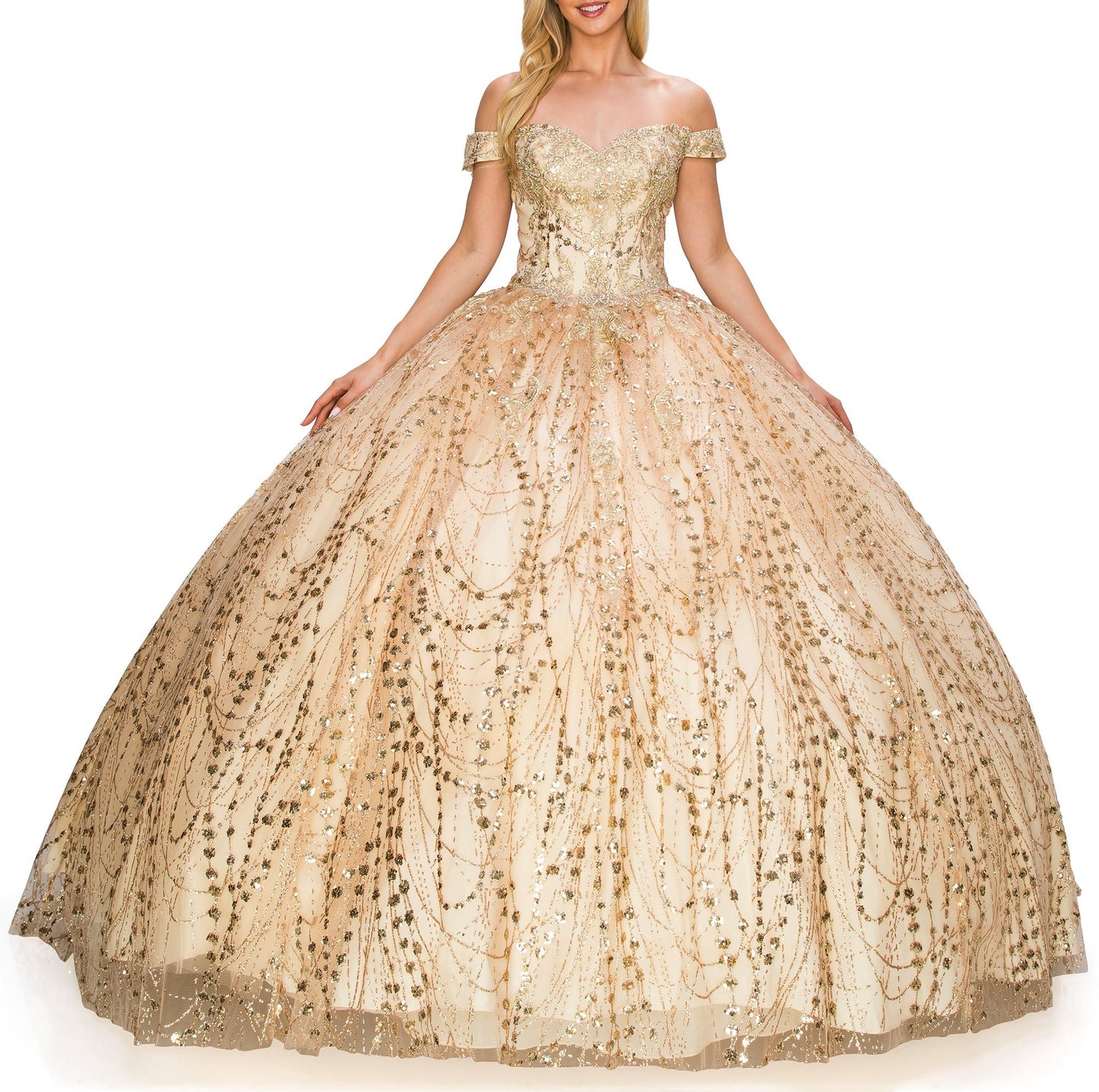 Front view of a woman wearing champagne quinceanera ball gown with sweetheart neckline, gold embroidery, and glitter bodice