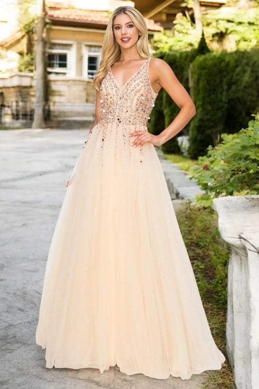 Full length- view of champagne formal dress with open V-length- and flowing skirt.