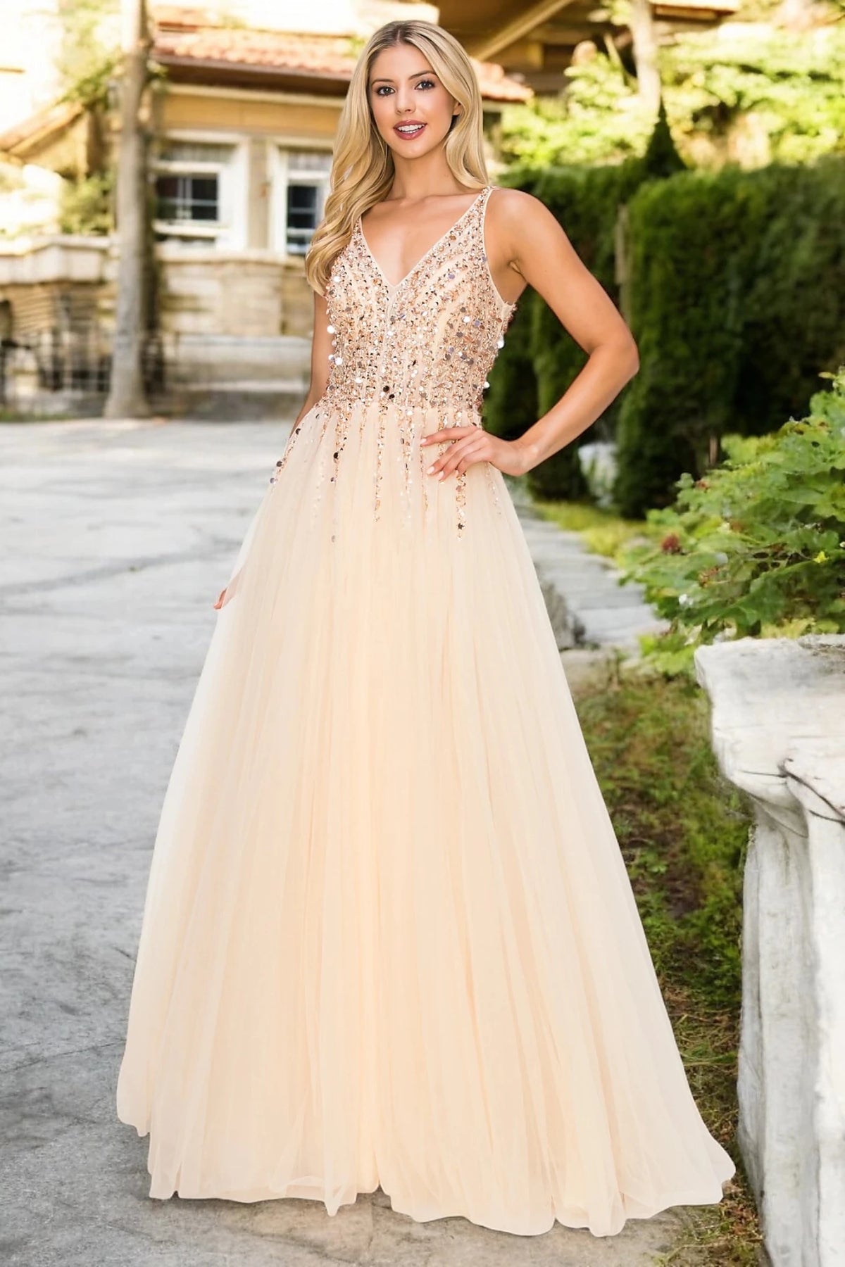 Skirt detail shows champagne evening dress with sequin and tulle skirt.