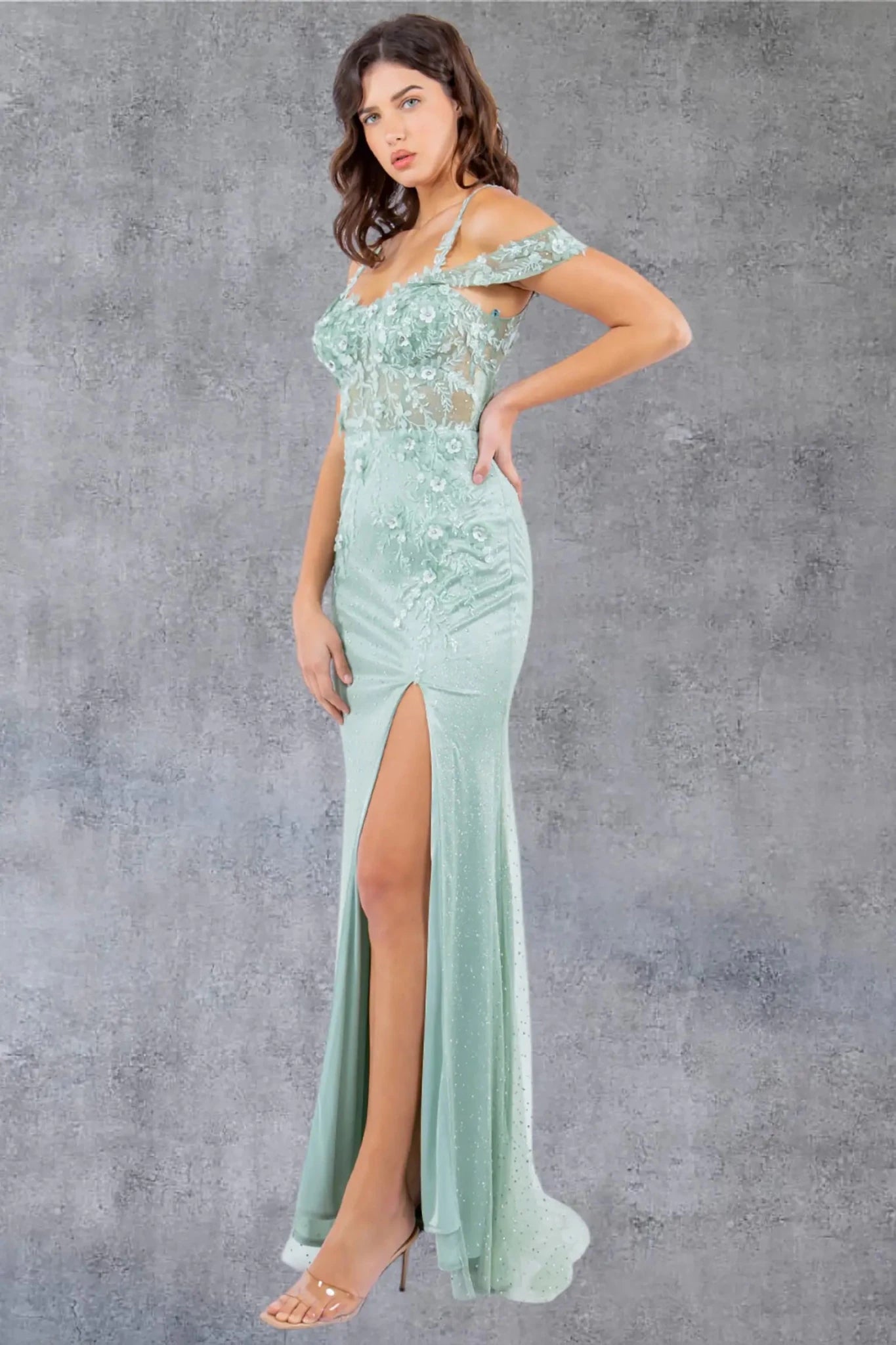 Sage prom gown showcasing dramatic thigh-high slit