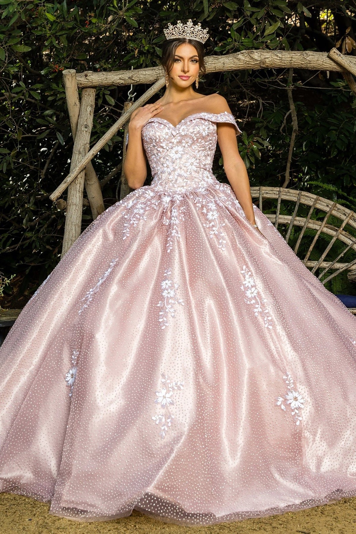 Full-length view highlights a dusty rose quinceanera dress with two-tone sequin floral embroidery, embossed tulle, and satin train.