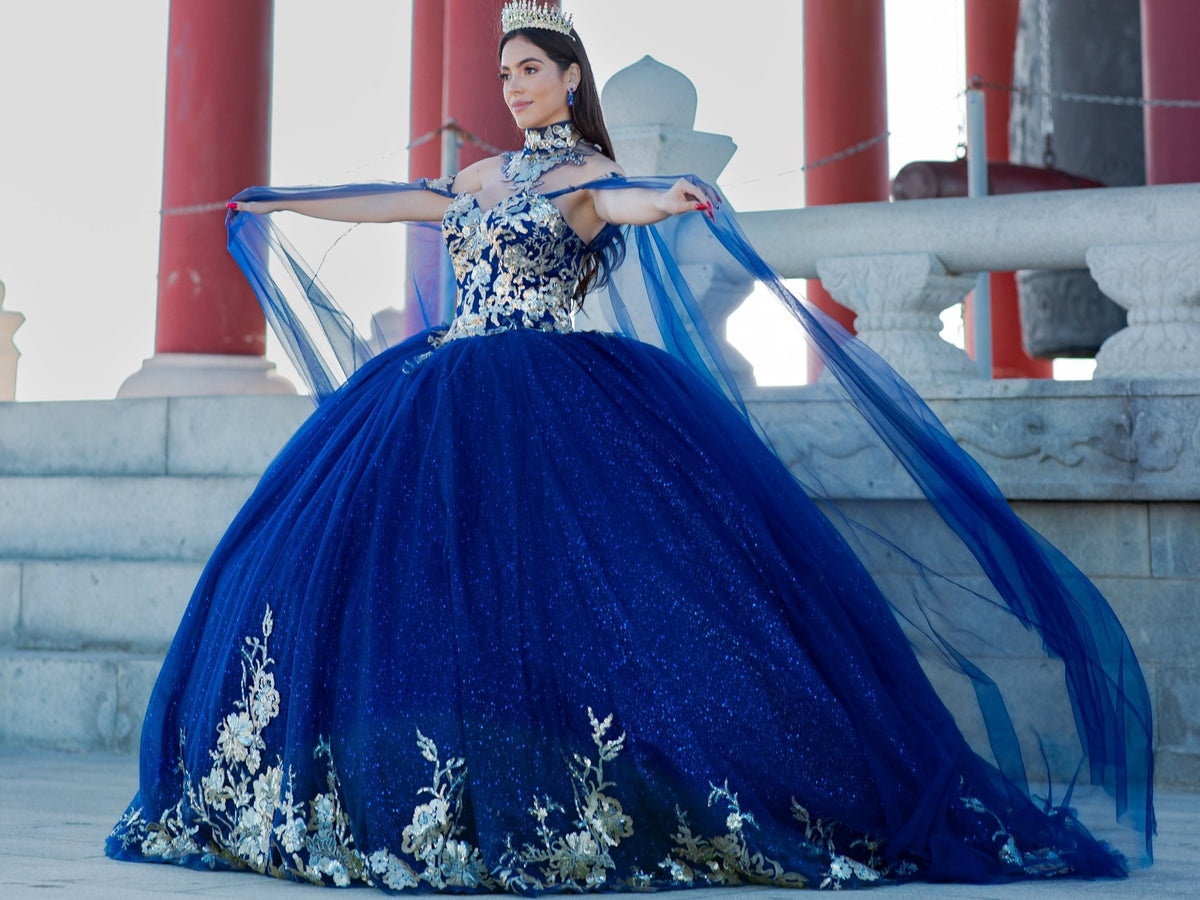 Side profile shows navy quinceanera ball gown with golden lace, detachable shoulder train sleeves, and satin fabric.