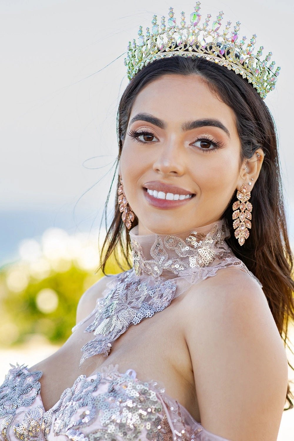 Shown in a bodice detail, the Blush quinceañera dress has high floral lace collar and sheer shoulder drape.