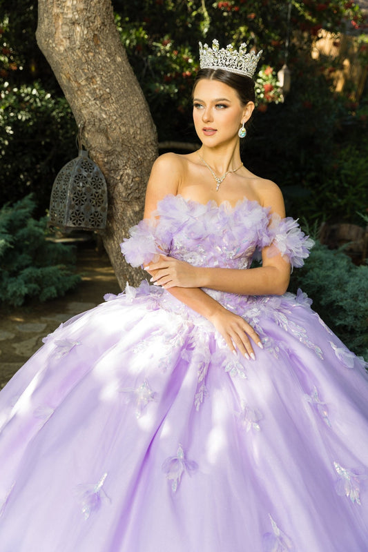 Front view of a woman wearing a lilac quinceanera dress with rainbow embroidery, sequin ruffle flowers, and crown detail