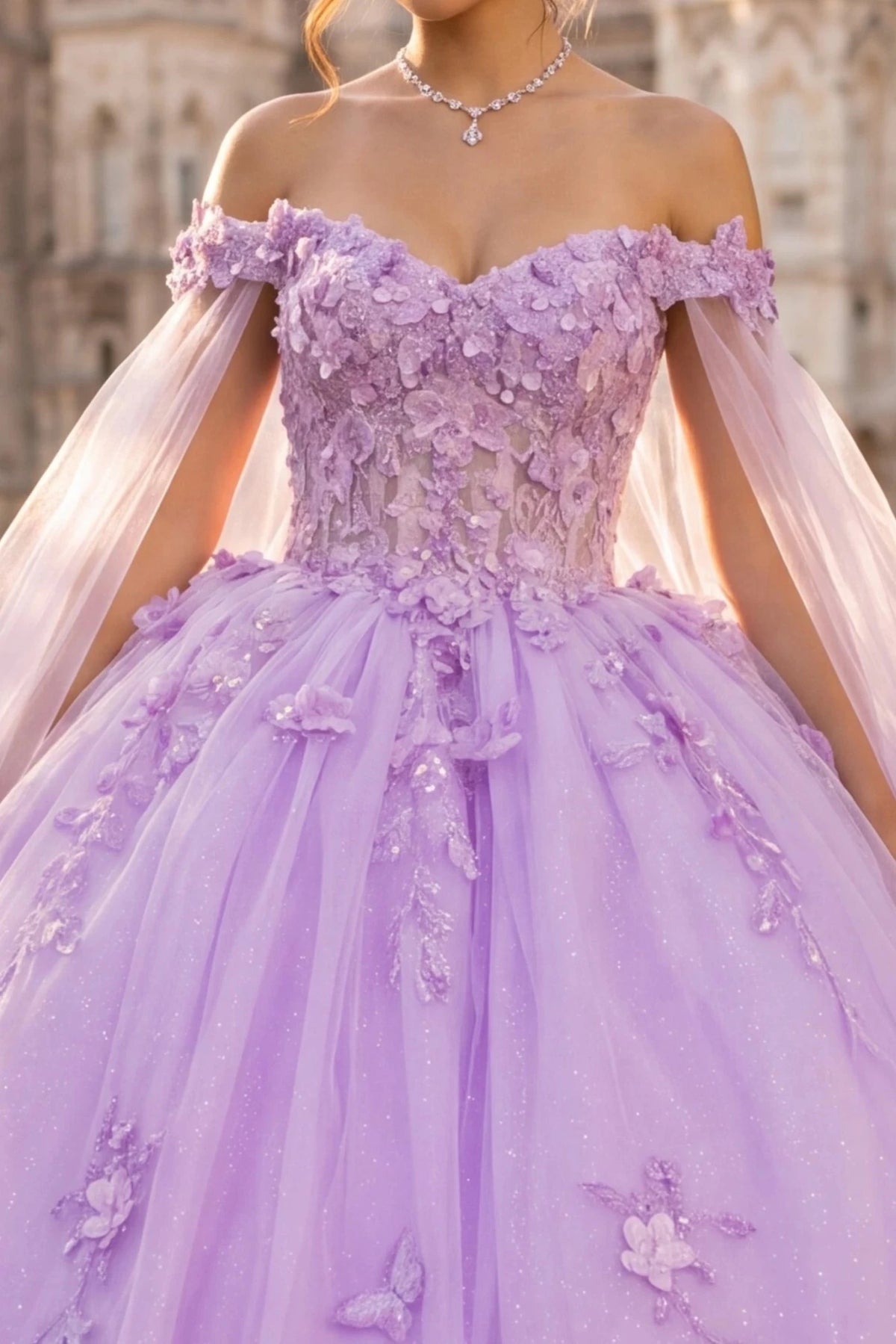 lavender ball gown with 3D floral appliqué, a sheer tulle bodice, and a voluminous tulle skirt with butterfly embellishments