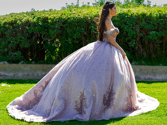 Quinceanera | Mauve Bead-Embroidered & Sequin Appliques Bodice Off-shoulder w/ Multiple Glitter Tulle Ballgown with Train - side view of woman wearing dress